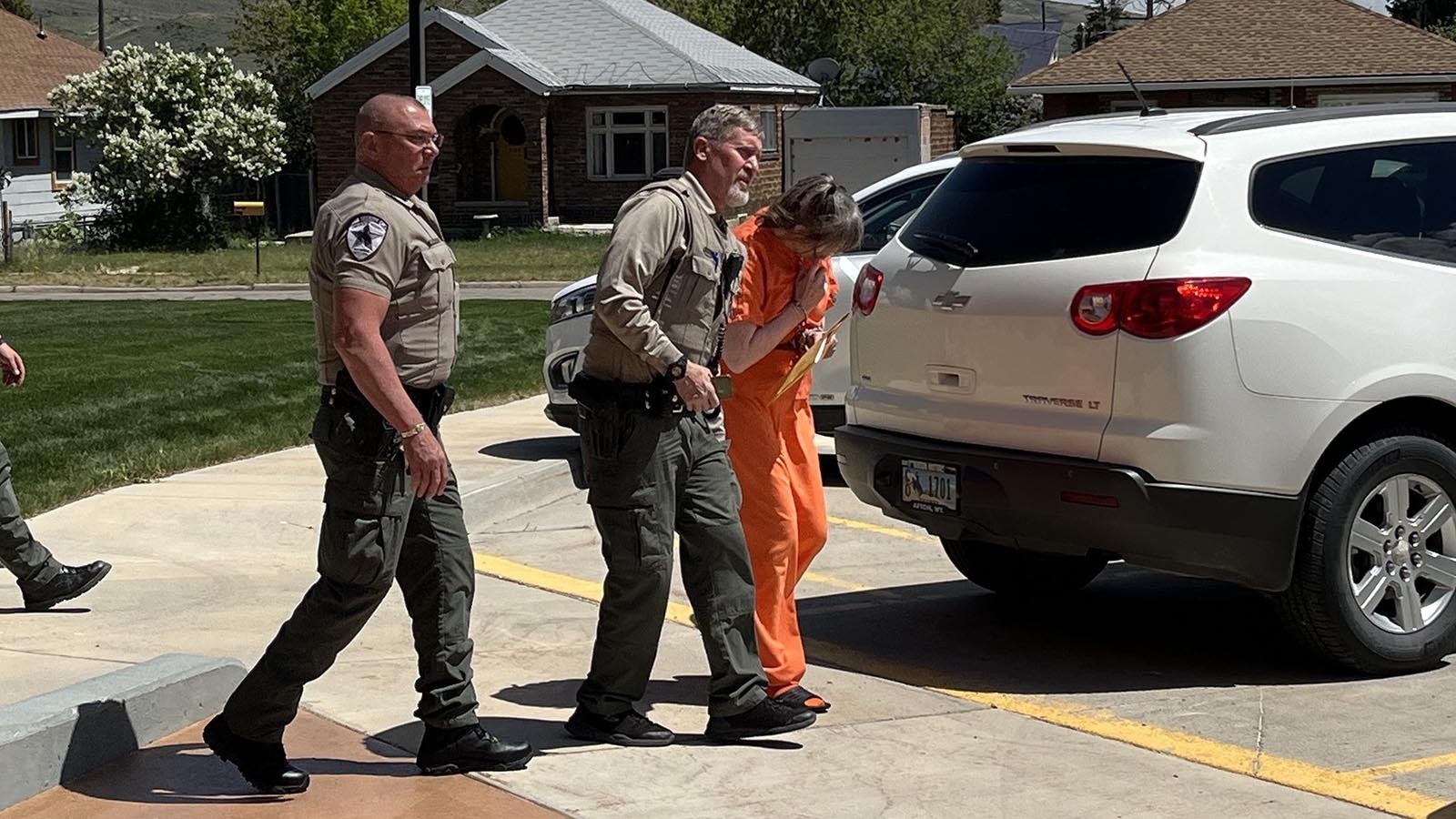 Cheri Marler, convicted of killing a 5-year-old girl in her care, hid her face after her sentencing hearing Wednesday, June 12, 2024, in Kemmerer, Wyoming.