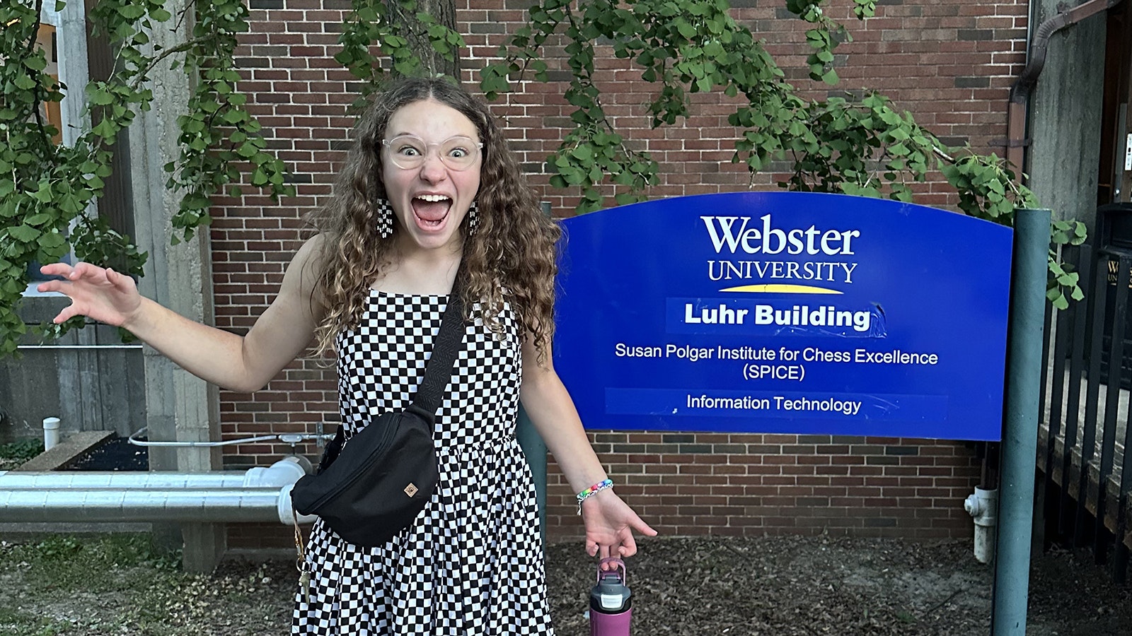 Kamari Barth wore checkered clothing and earrings similar to chess boards during the Susan Polgar Girls' Chess Tournament Invitational held at Webster University in St. Louis.