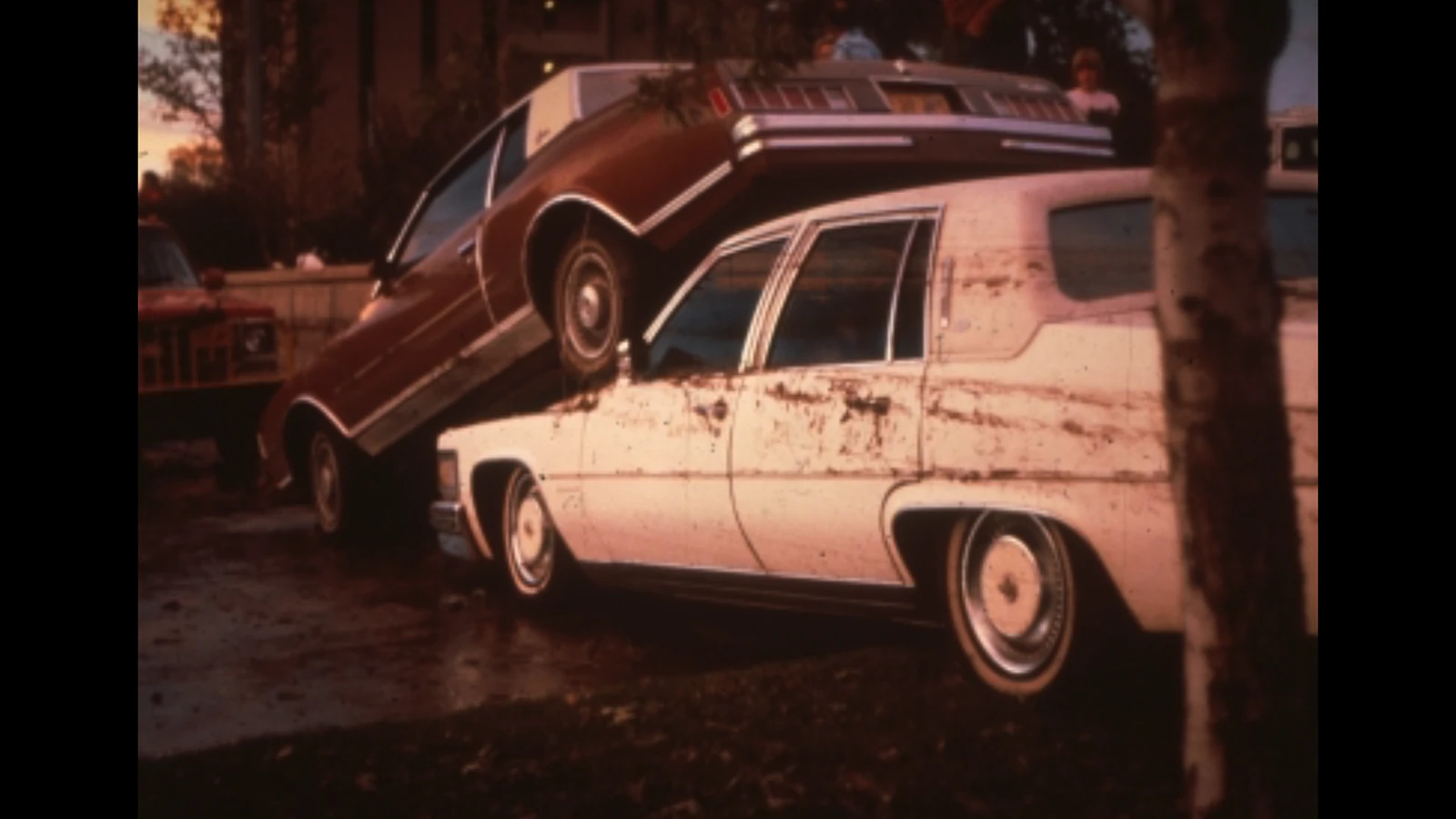 Cars left stacked after floodwaters receded.