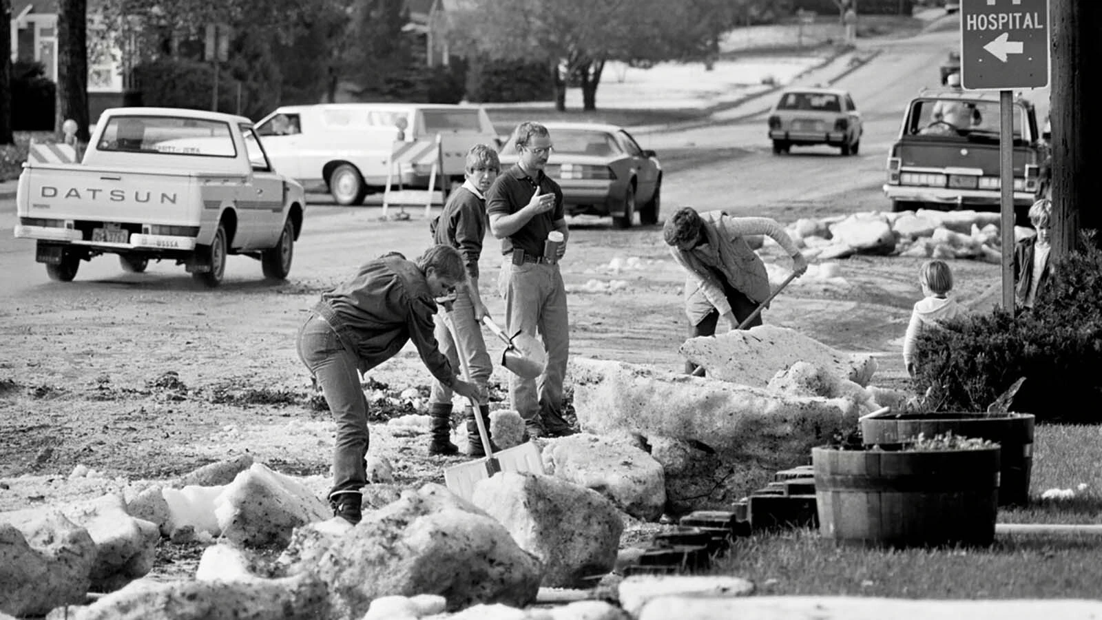 Crews get to work to clean up mounds of hail and debris that covered streets throughout the capital city.