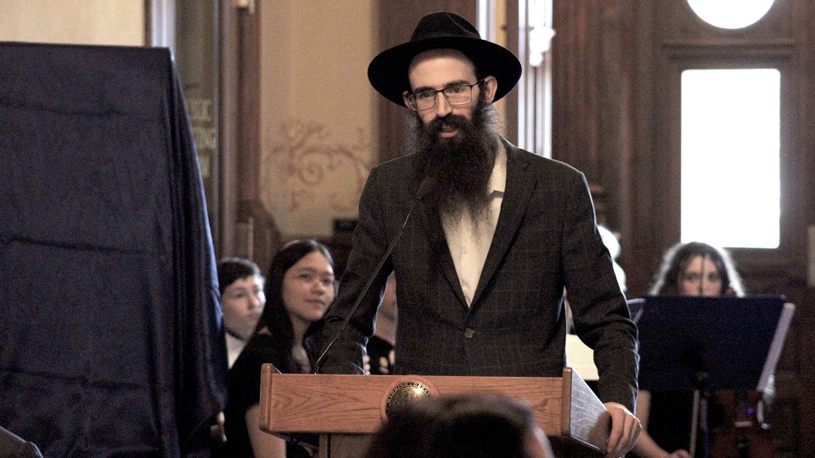 Rabbi Yaakov Raskin of the Chabad Lubavitch of Laramie Jewish temple talks at Monday's Chanukah event at the state Capitol.