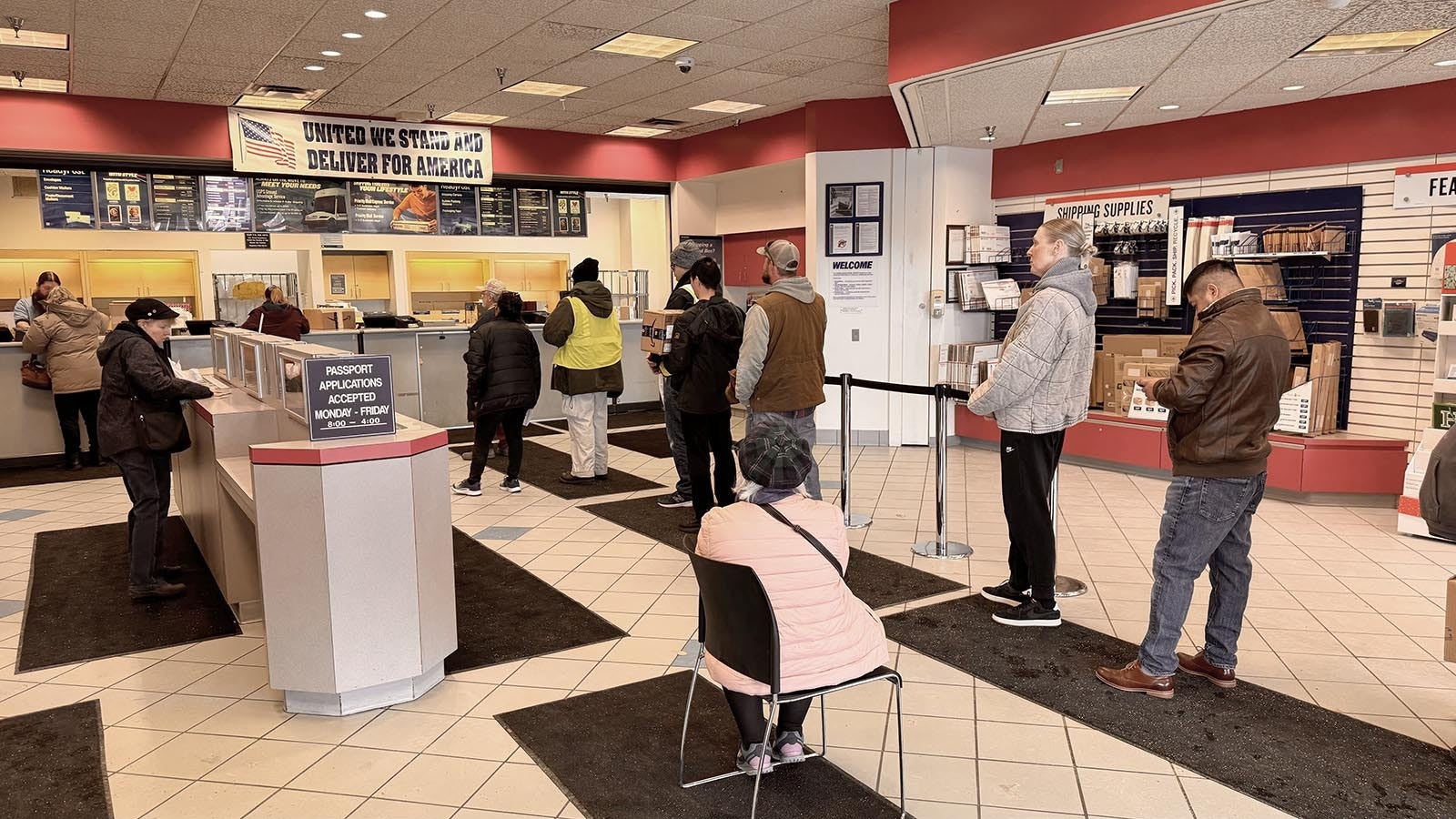 A long line of people waits for service at the Cheyenne U.S. Post Office annex.