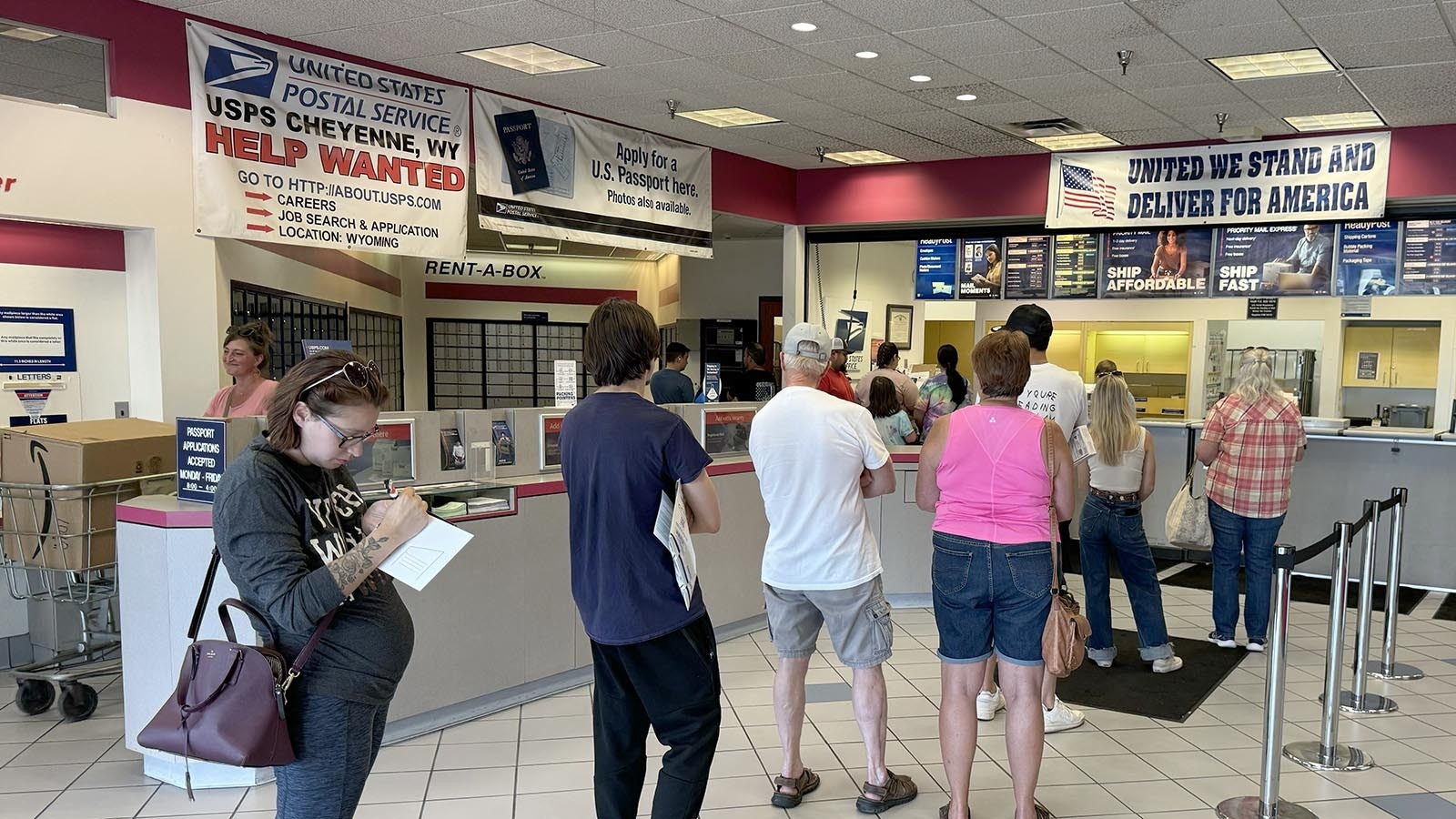 People line up Friday at the U.S. Postal Service annex on Converse Avenue in Cheyenne on Friday, Aug. 23, 2024.