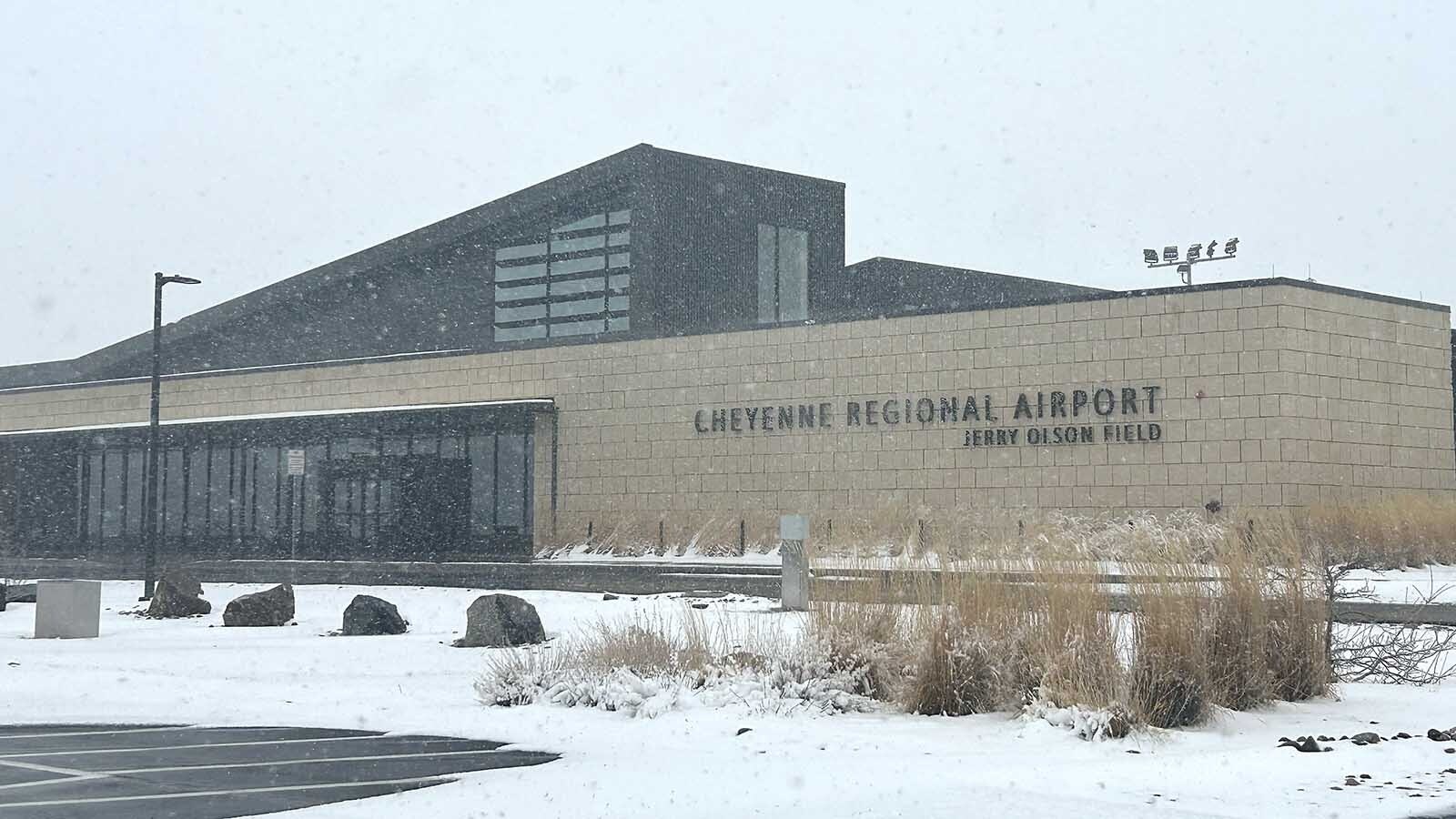Snow falls from an overcast sky at Cheyenne Regional Airport on Thursday.
