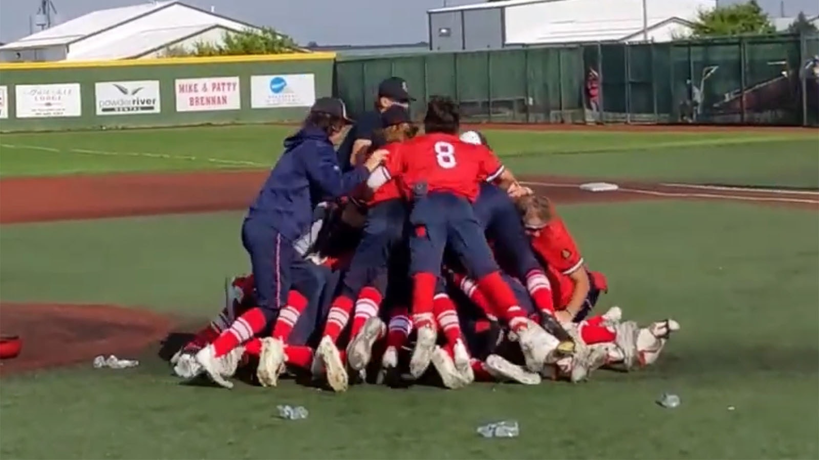 The Cheyenne Sixers dogpile on the mound after the final out that sent them to the 2023 American Legion World Series, the first Wyoming team ever to make the ALWS.