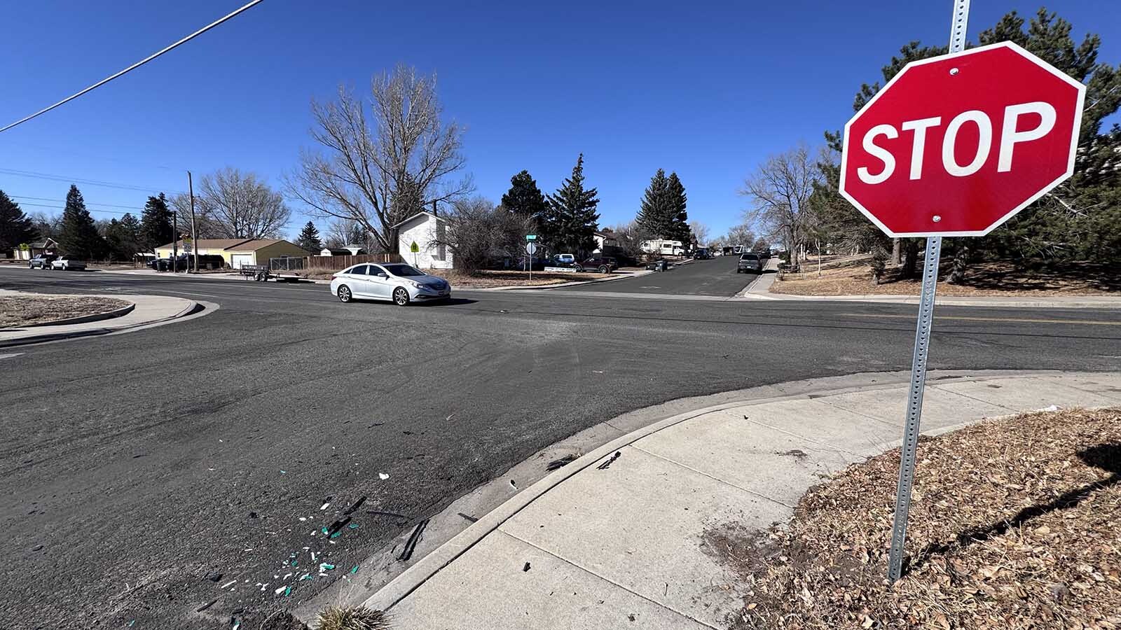 A temporary stop sign and debris are what's left of a wild Monday car chase in Cheyenne where a woman allegedly crashed into her ex-boyfriends car twice, taking out the stop sign at the intersection of East 12th Street and Madison Avenue.