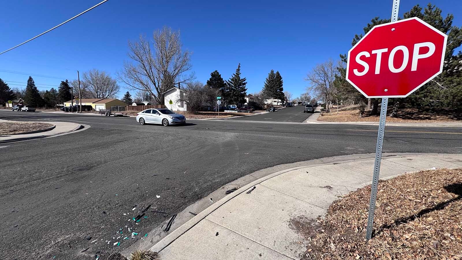 A temporary stop sign and debris are what's left of a wild Monday car chase in Cheyenne where a woman allegedly crashed into her ex-boyfriends car twice, taking out the stop sign at the intersection of East 12th Street and Madison Avenue.