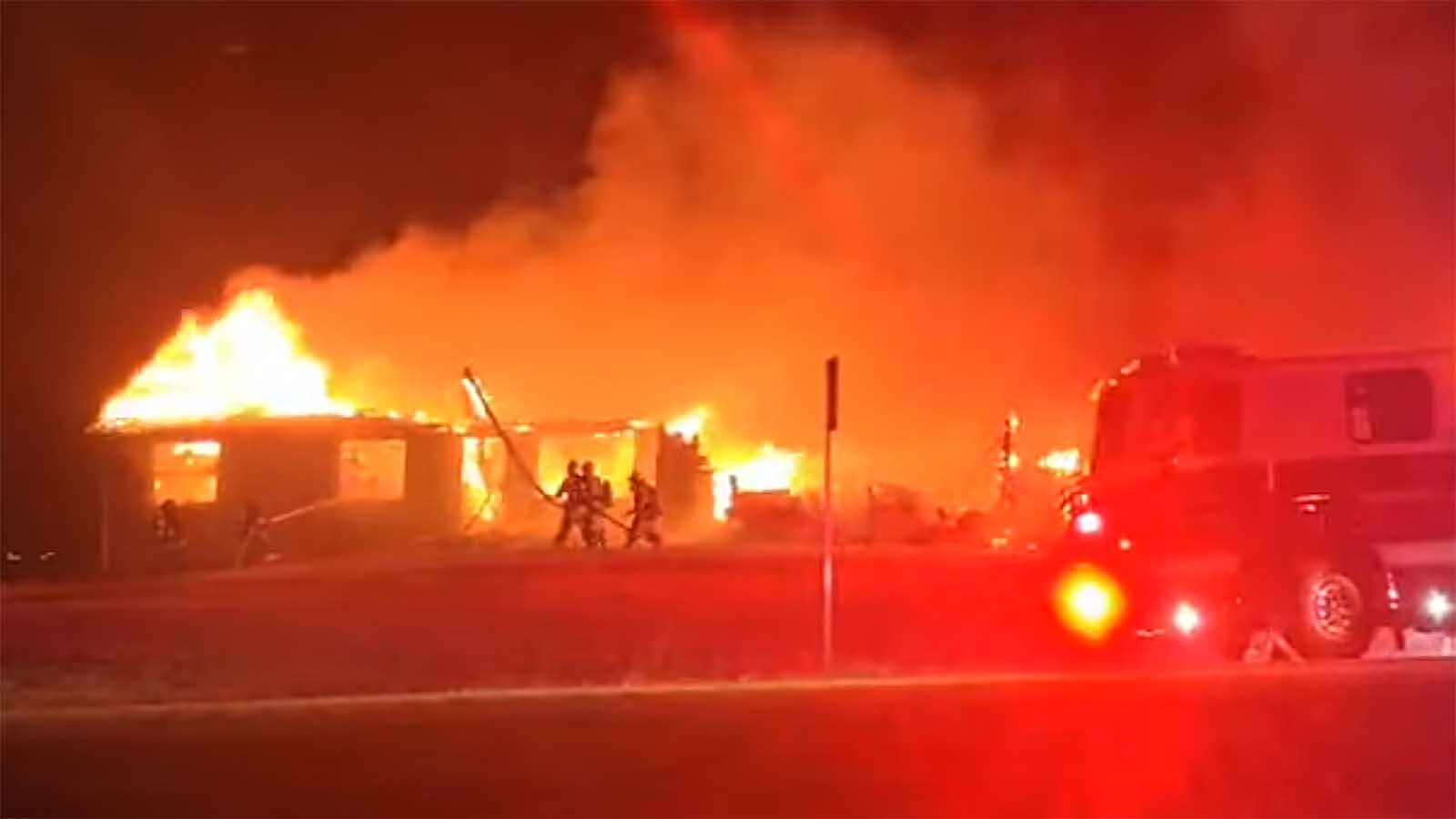 A south Cheyenne family escaped with just the clothes on their backs Tuesday when a fast-moving fire, whipped by strong winds, ripped through their home. The fire also burned three vehicles and all their Christmas presents.