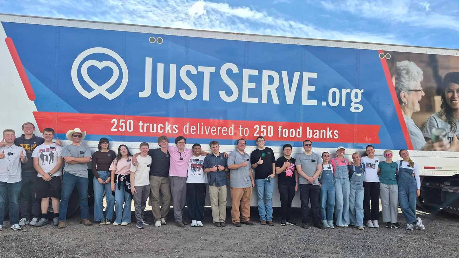 Volunteers and employees of four hunger-relief agencies in Cheyenne — Needs Inc., Meals on Wheels, the Salvation Army and St. Joseph's Food Pantry — pose for a photo after helping empty an America250 "Just Serve" truck with 42,000 pounds of food on Wednesday morning.