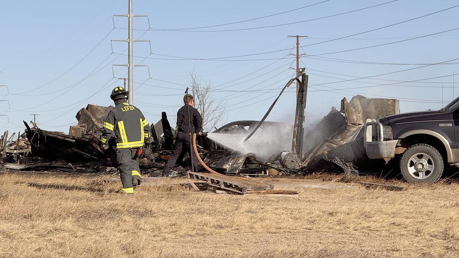 A south Cheyenne family escaped with just the clothes on their backs Tuesday when a fast-moving fire, whipped by strong winds, ripped through their home. The fire also burned three vehicles and all their Christmas presents.