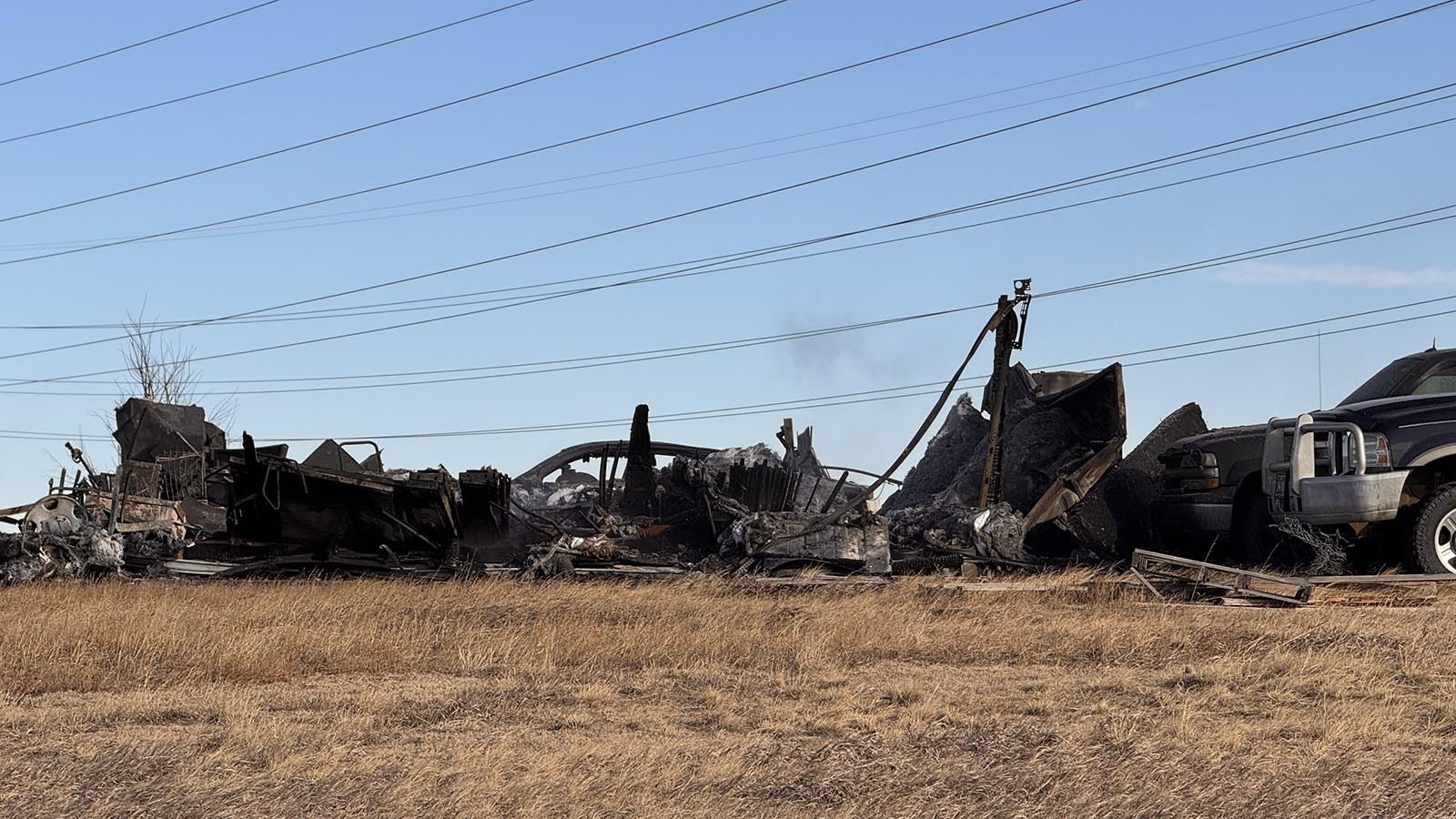 A south Cheyenne family escaped with just the clothes on their backs Tuesday when a fast-moving fire, whipped by strong winds, ripped through their home. The fire also burned three vehicles and all their Christmas presents.