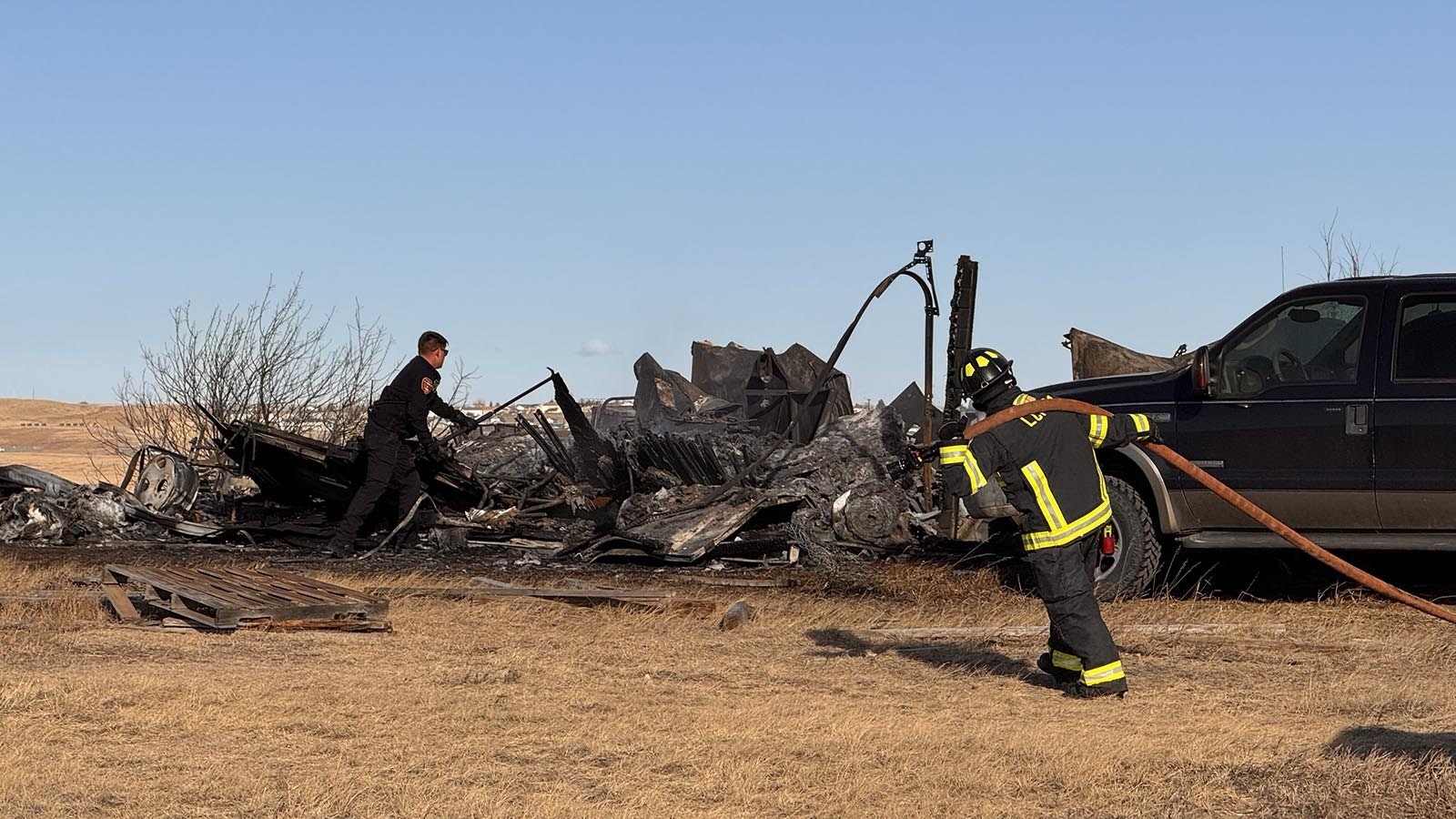 A south Cheyenne family escaped with just the clothes on their backs Tuesday when a fast-moving fire, whipped by strong winds, ripped through their home. The fire also burned three vehicles and all their Christmas presents.