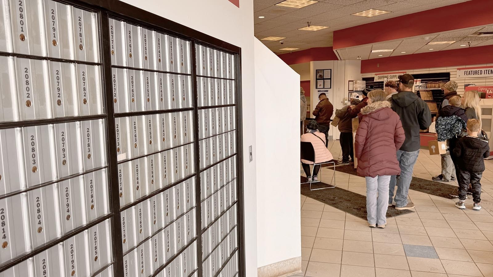 People line up to be helped at the Cheyenne Post Office, where they also can access P.O. boxes.