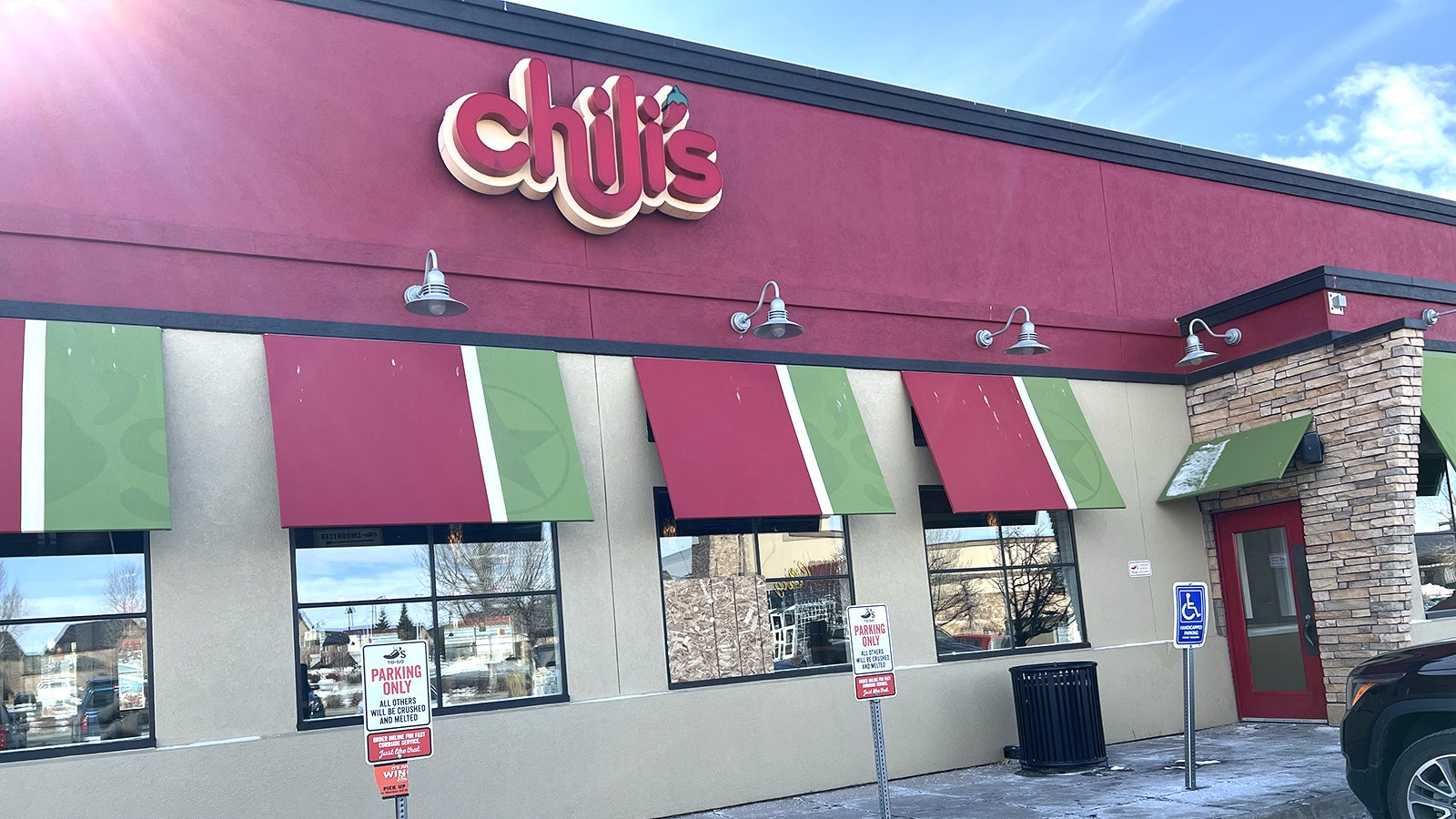 One of the windows broken at the Laramie Chili's restaurant remains boarded up after a man who was trespassed from the property allegedly came back and broke windows.
