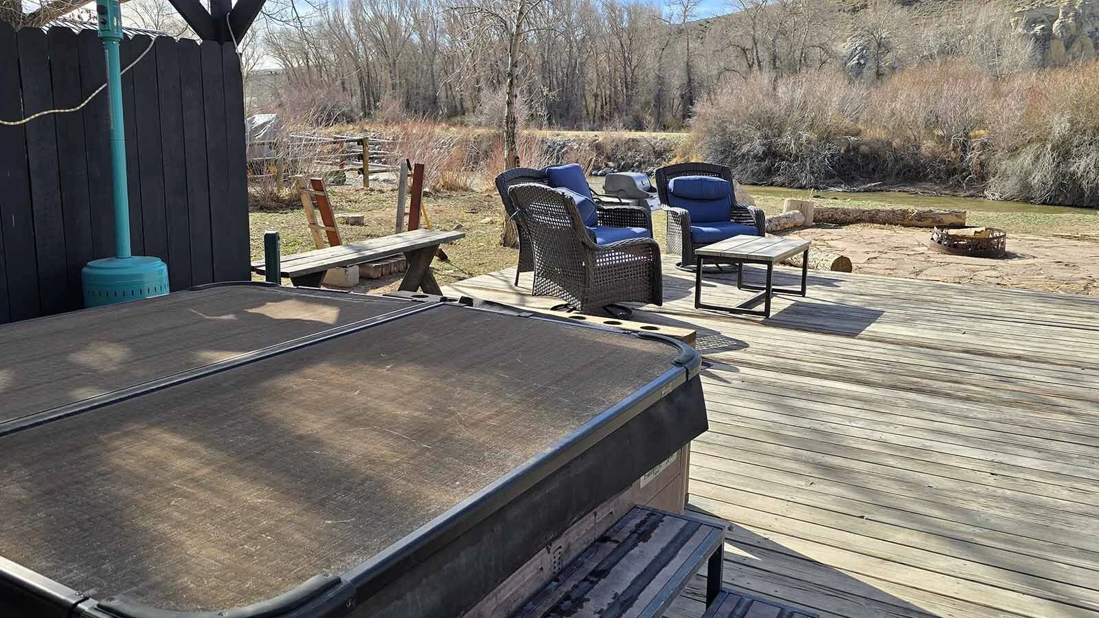The riverside hot tub offers a lovely view at Chinook Winds Lodge.
