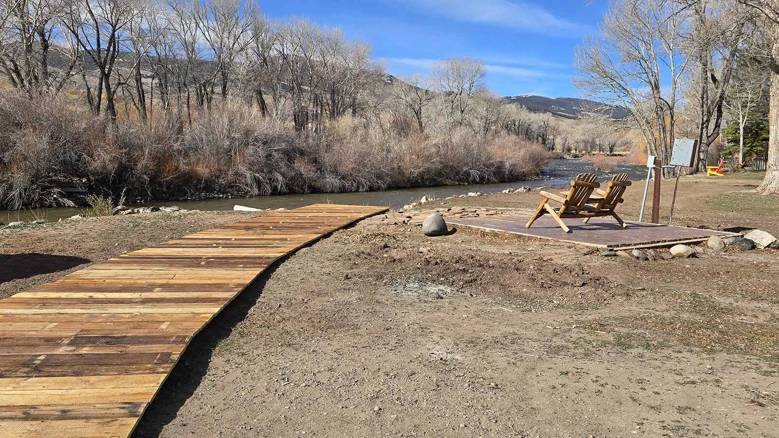 A newly built boardwalk leads down to the Wind River, where wandering awaits. A pair of deck chairs, meanwhile, are situated for perfect star gazing once the sun has set at Chinook Winds Lodge.