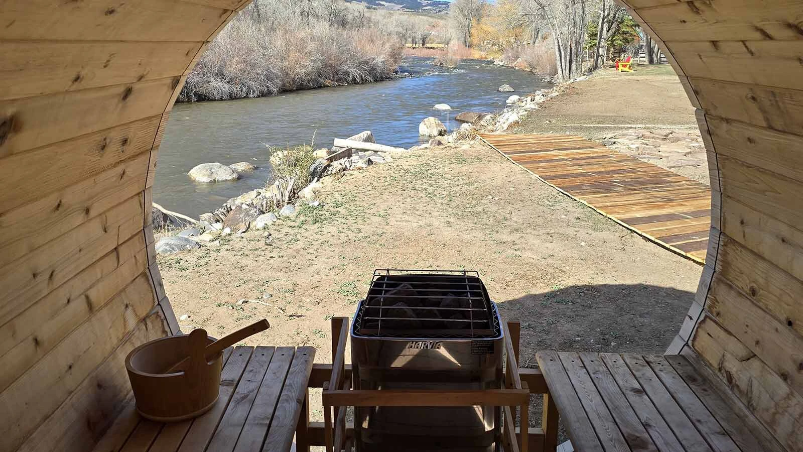 Inside, the sauna has a clear window, offering a full on view of the Wind River.