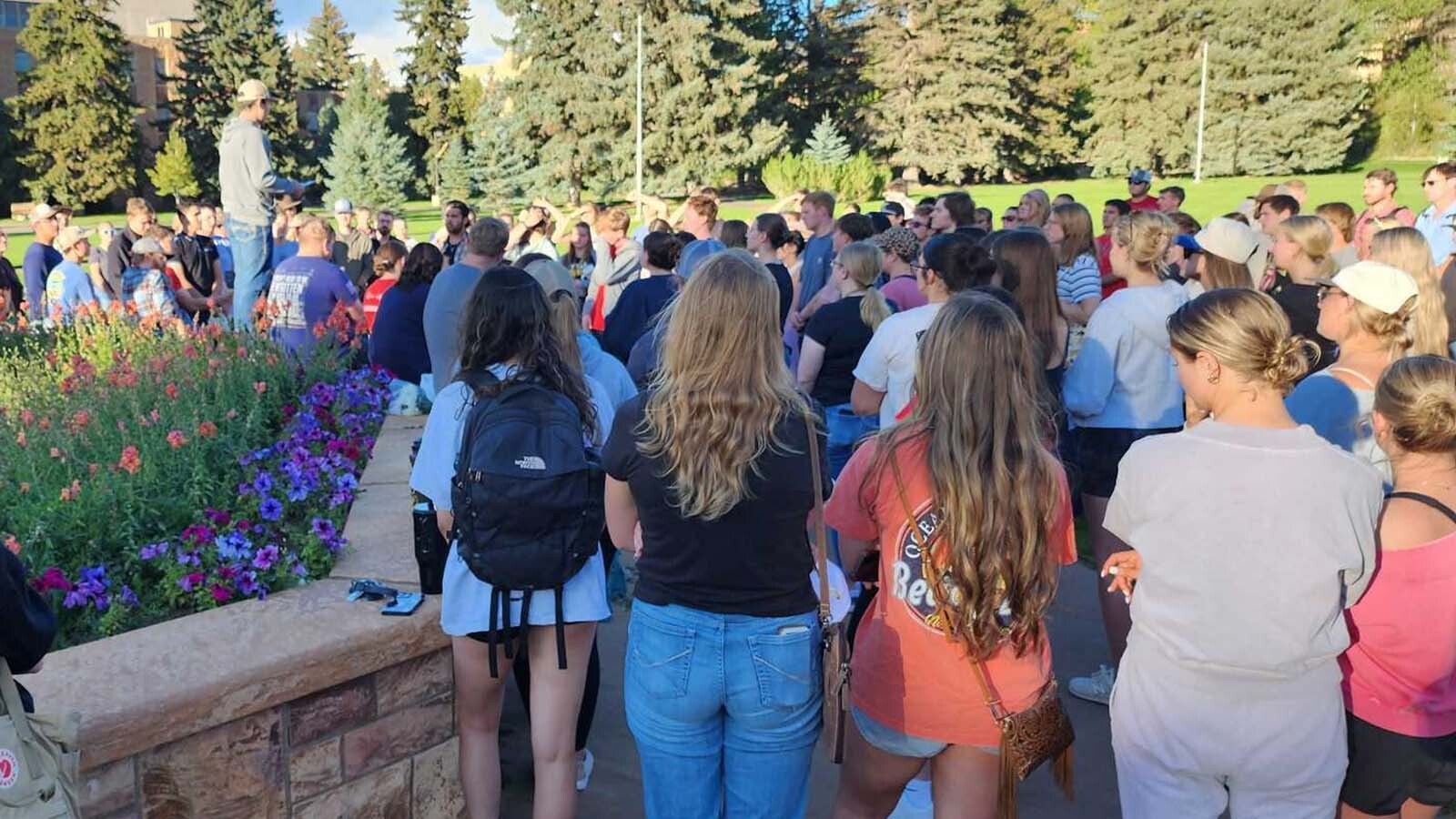 Students gather at Prexie's Pasture, a large outdoors common area on the University of Wyoming Campus, on Wednesday, Sept. 10, 2025, to remember Charlie Kirk, who was killed earlier in the day.