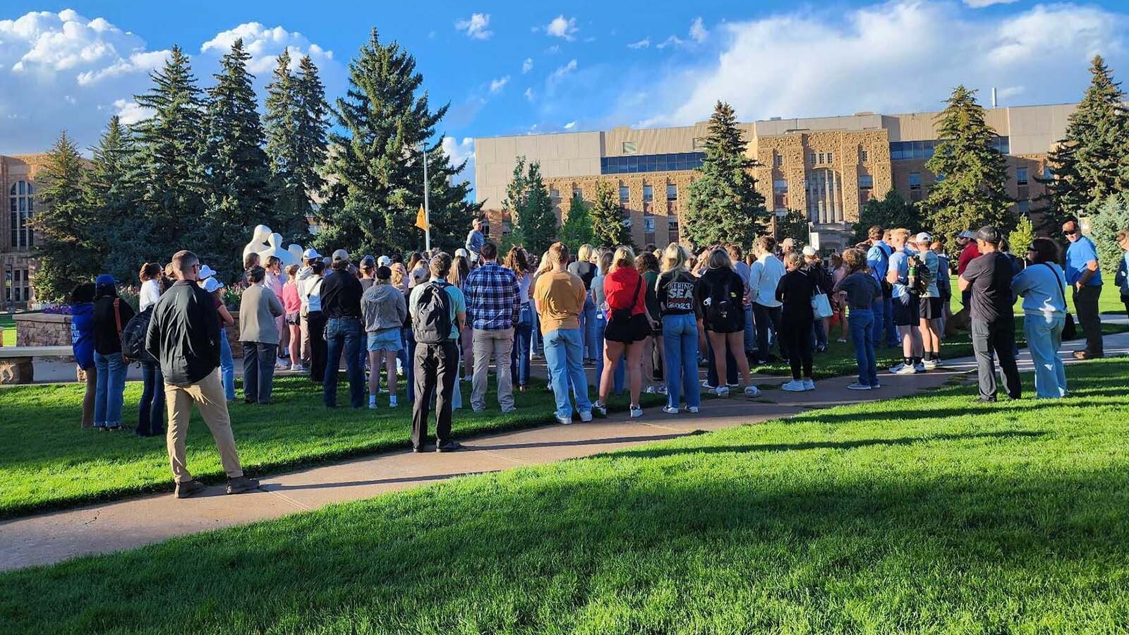 Students gather at Prexie's Pasture, a large outdoors common area on the University of Wyoming Campus, on Wednesday, Sept. 10, 2025, to remember Charlie Kirk, who was killed earlier in the day.