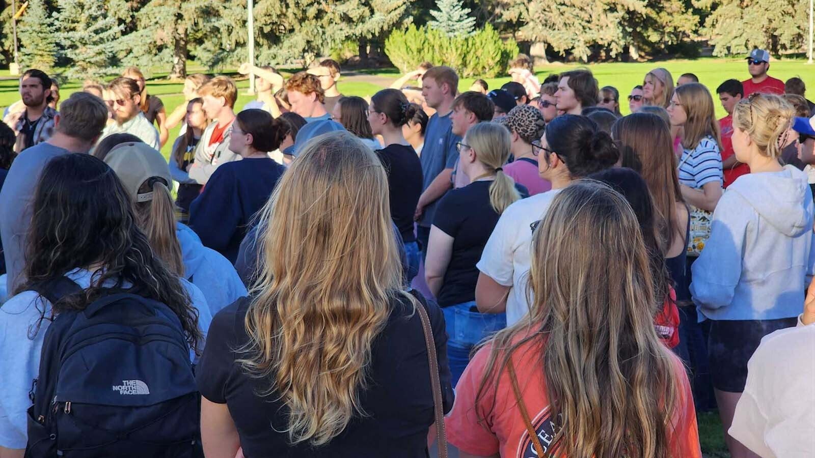 Students gather at Prexie's Pasture, a large outdoors common area on the University of Wyoming Campus, on Wednesday, Sept. 10, 2025, to remember Charlie Kirk, who was killed earlier in the day.