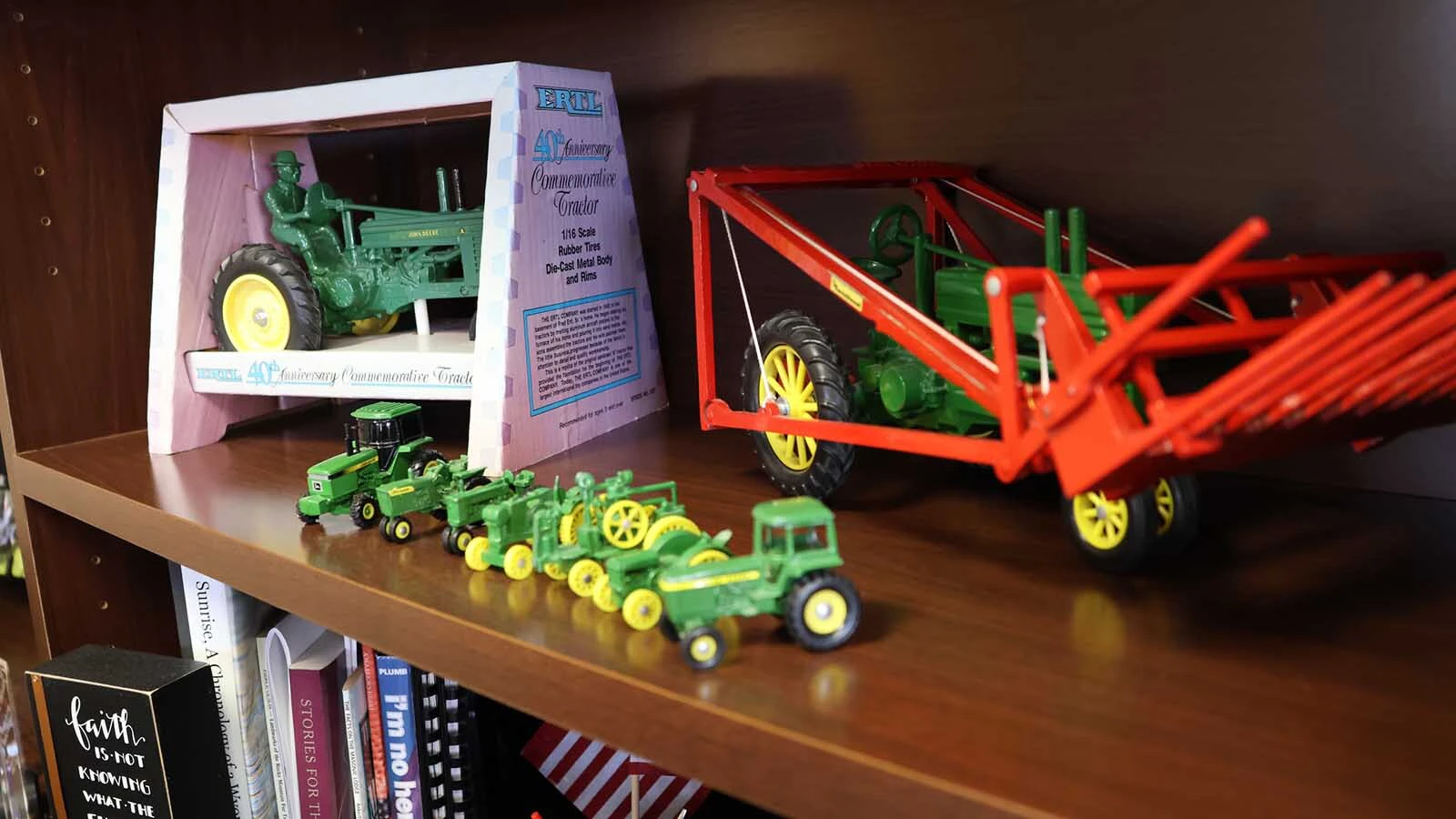 Chuck’s office shelf features a collection of toy farm tractors. He began his entrepreneurial career selling farm equipment in Wheatland.