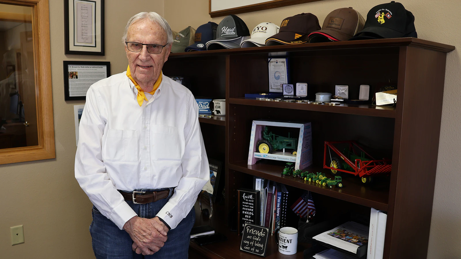Chuck Brown and his collection of hats in his office.