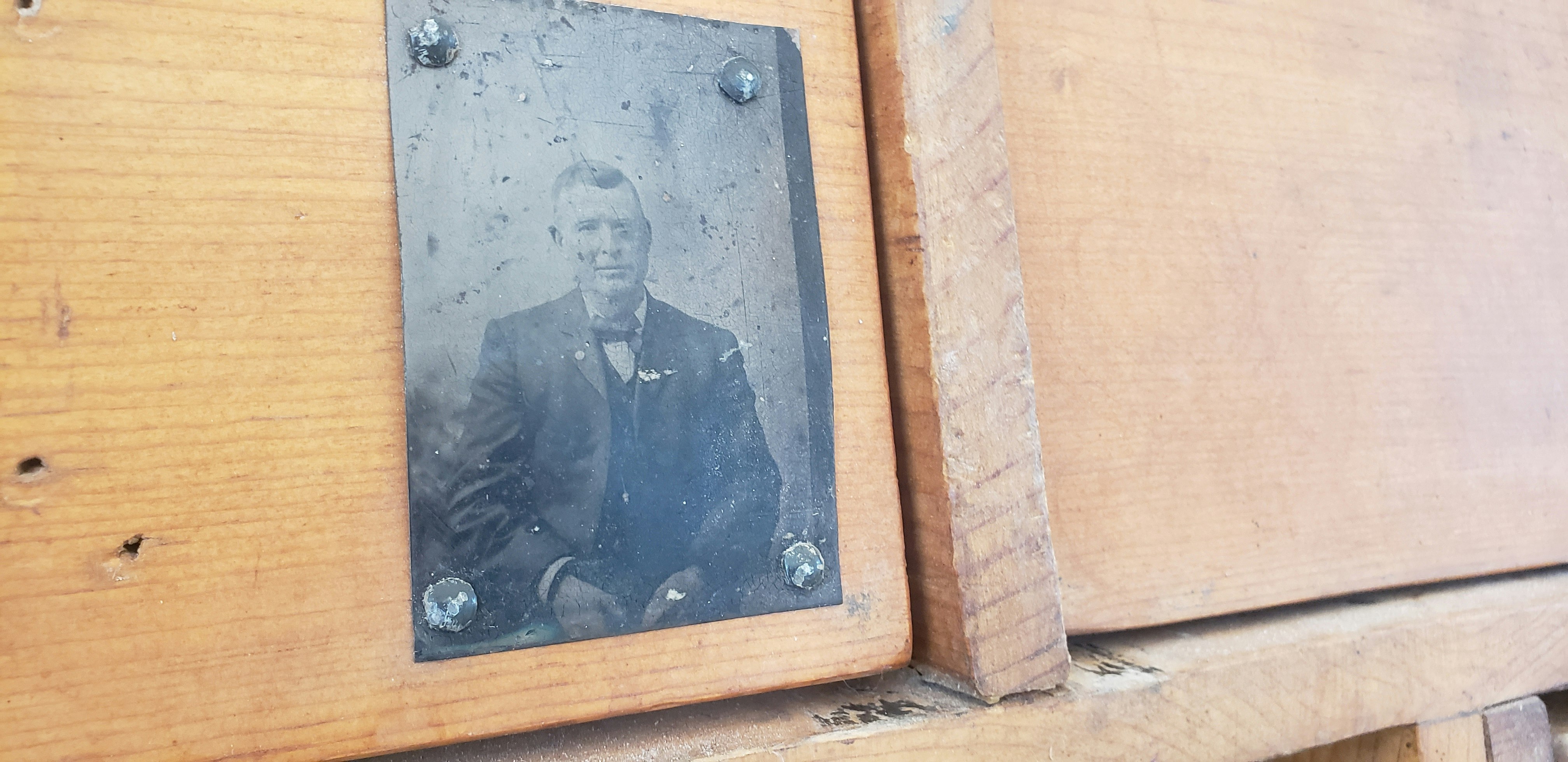 An old tintype photo is affixed to the chuckwagon belonging to Rich and Deb Hermon of Cody. It is a 1902 original Peter Schuttler chuckwagon that was in use into the 1950s.