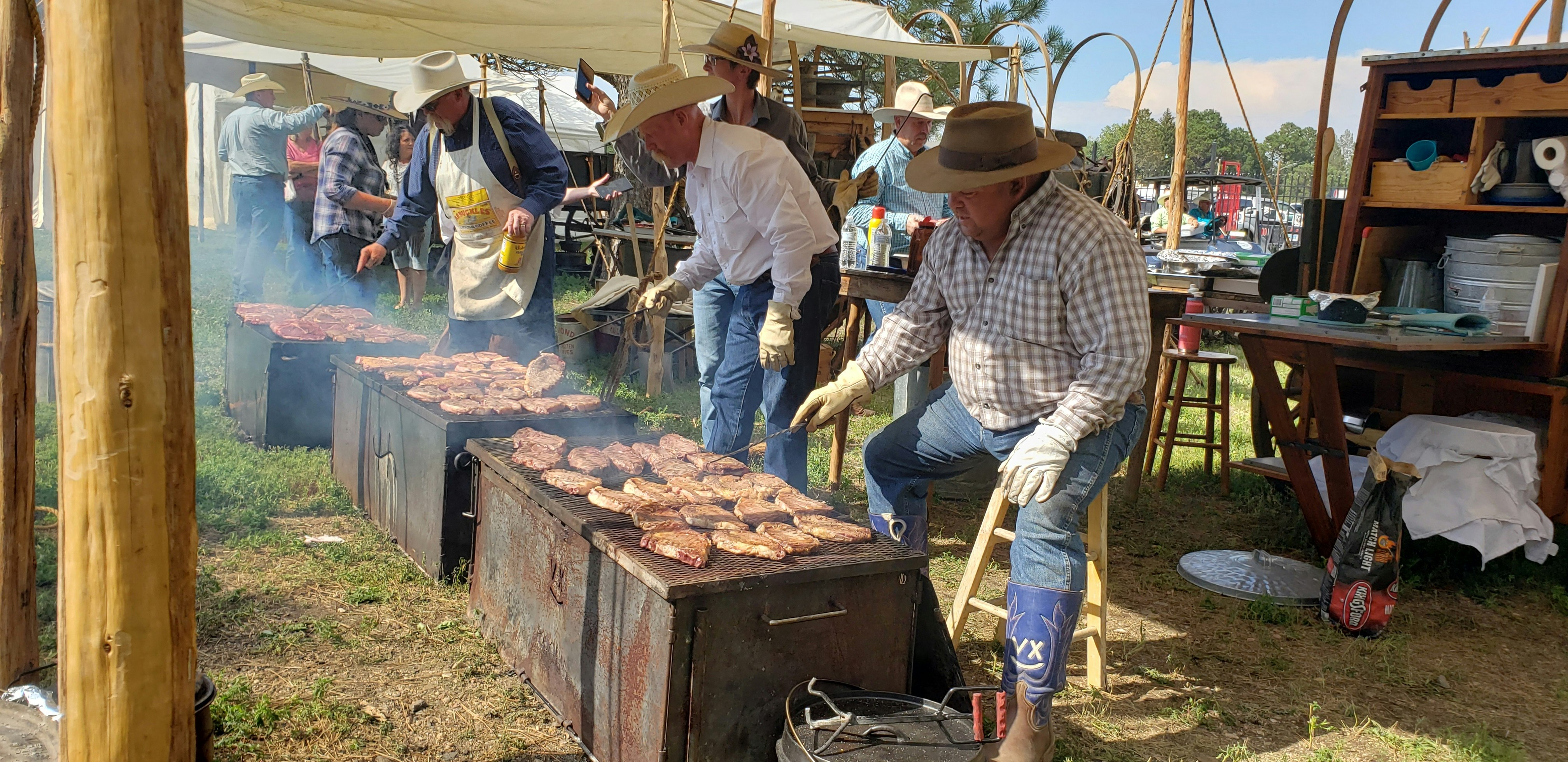 Each chuckwagon cook has an authentic blacksmith-made steak flipper to keep the ribeyes moving over the smoky fire.