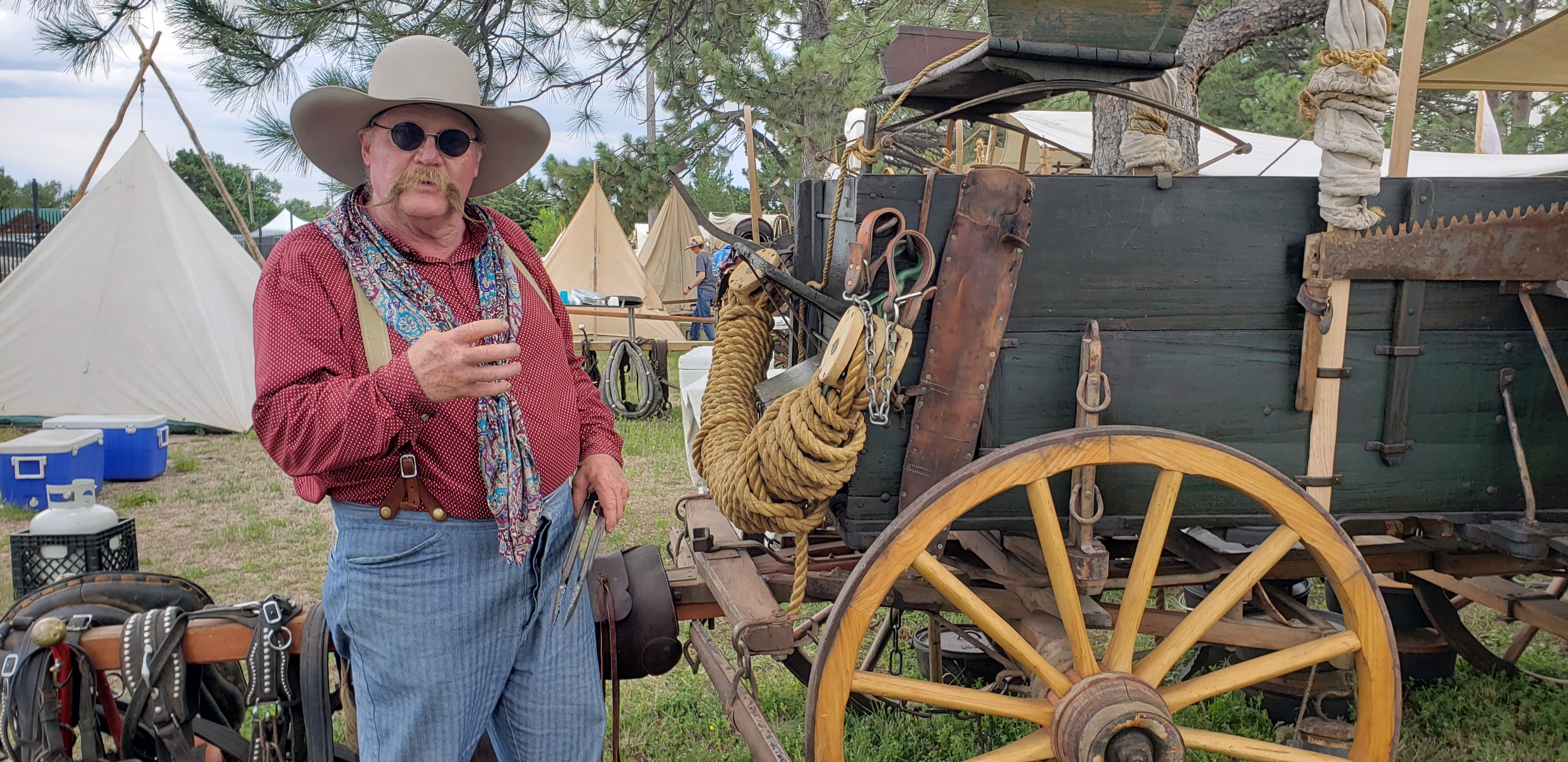 https://cowboystatedaily.imgix.net/Chuckwagon-Rich-Herman-talks-about-the-1902-Peter-Schuttler-Wagon-he-and-his-wife-Deb-use-for-chuckwagon-cooking-events-like-the-one-at-Cheyenne-Frontier-Days-7.28.23.jpg