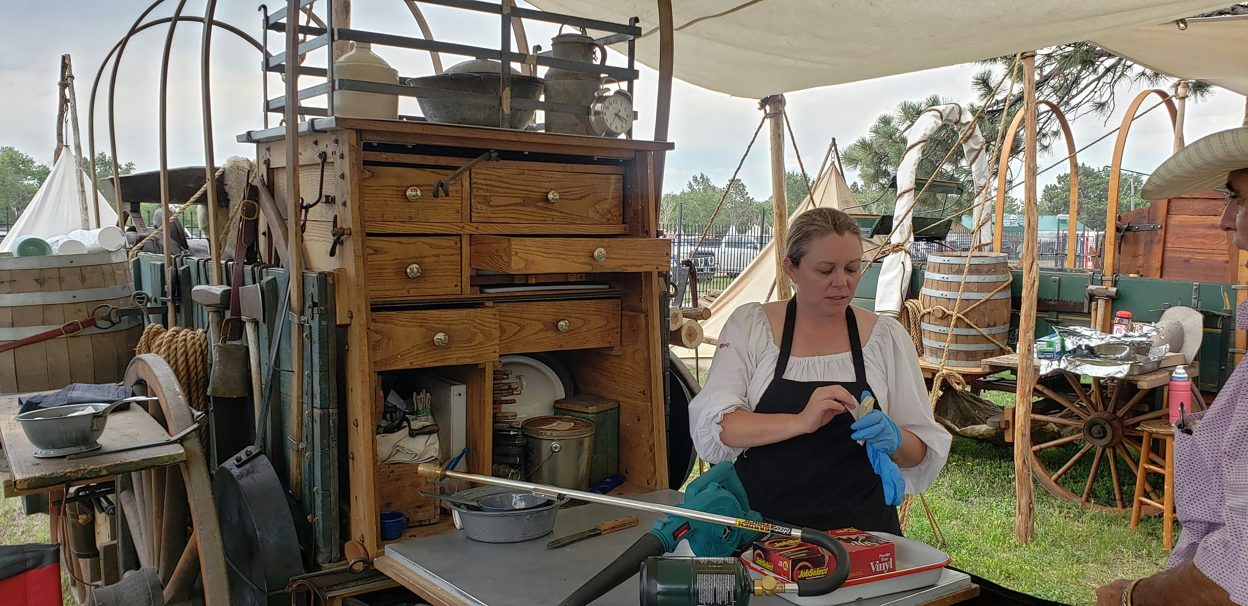 Tammy Fleischacker gets ready to cook up some steaks at the chuckwagon encampment during Cheyenne Frontier Days.