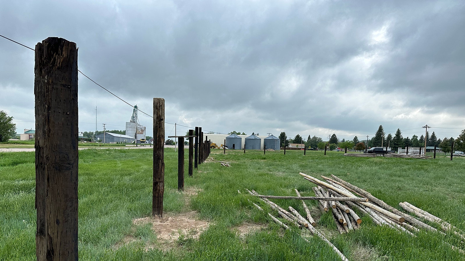 A line of fence posts have been sunk on the site of Chugwater's new arena, which will be located in the same lot, but has been purchased for the cookoff.