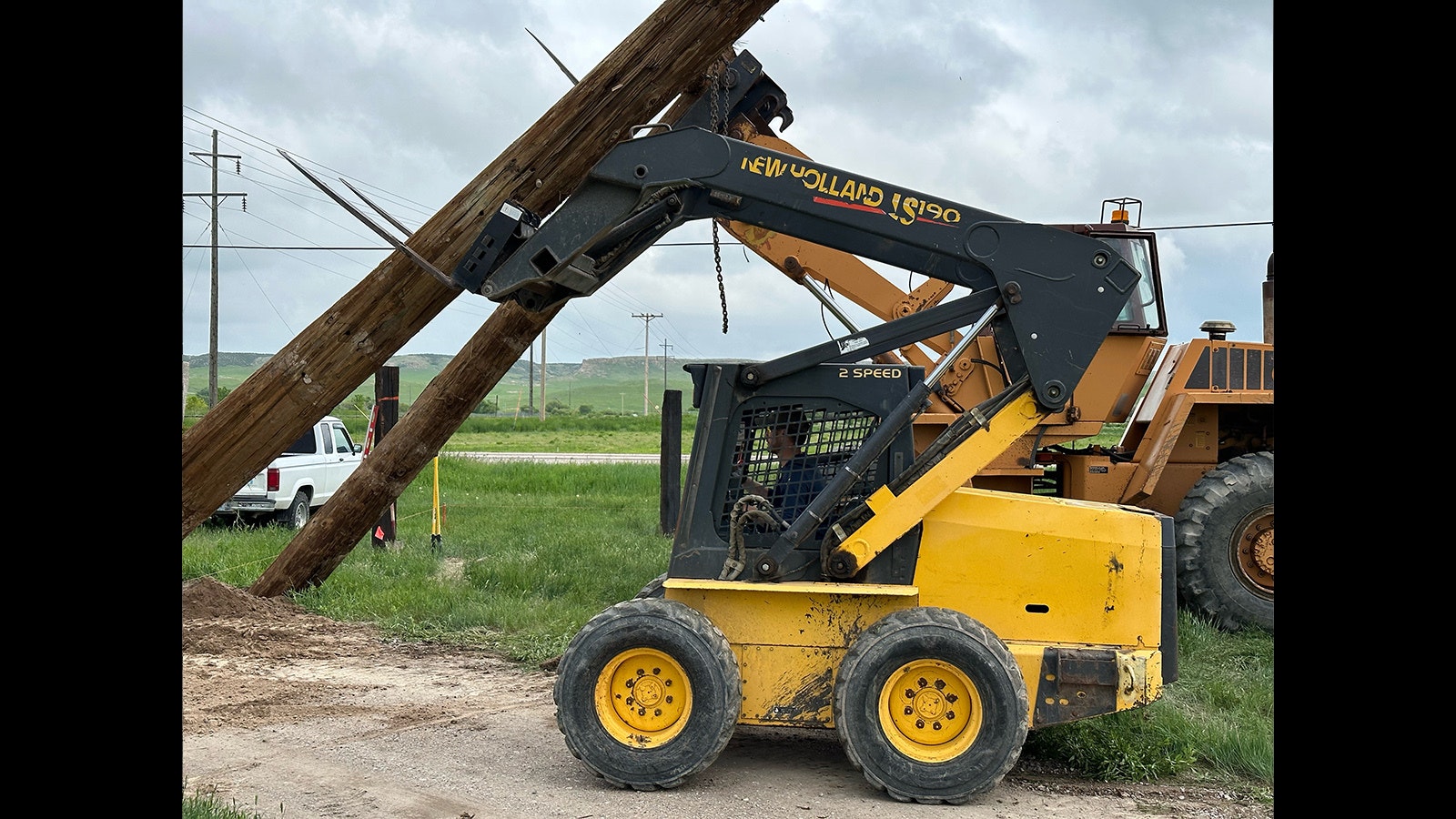 Heavy equipment is being used to erect new and permanent posts for Chugwater's new chili cookoff arena.
