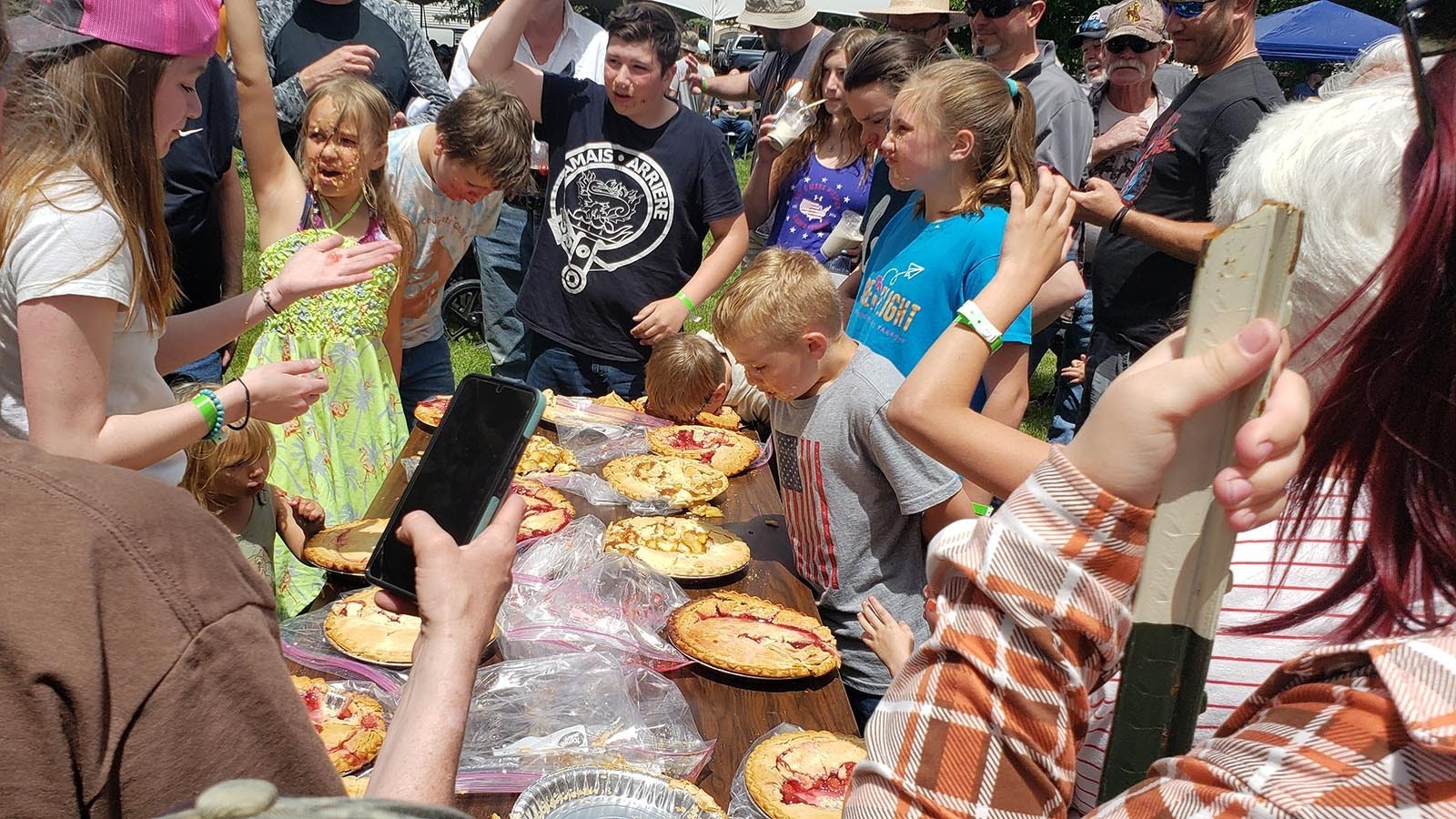 Kids dive fact-first into the pie-eating competition at the Chugwater Chili Cookoff on Saturday.