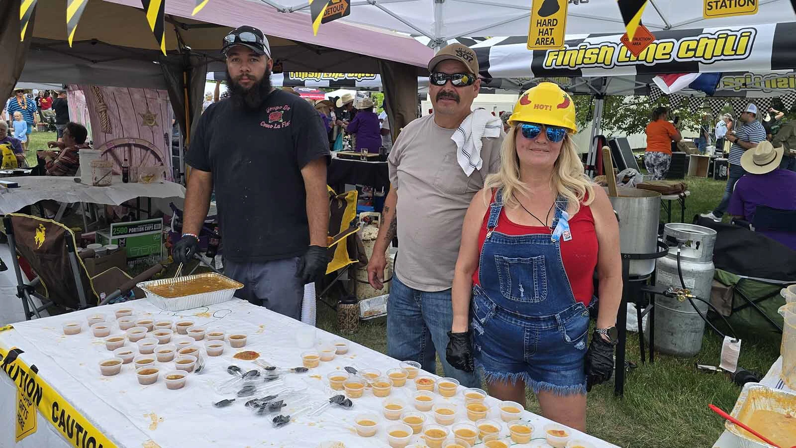 From left, Robert Ganzenmuller, Casey Medina, and Kat Medina pose for a picture at the Chugwater Chili Cook-off. It's become a family tradition for them to participate in this Father's Day weekend event.
