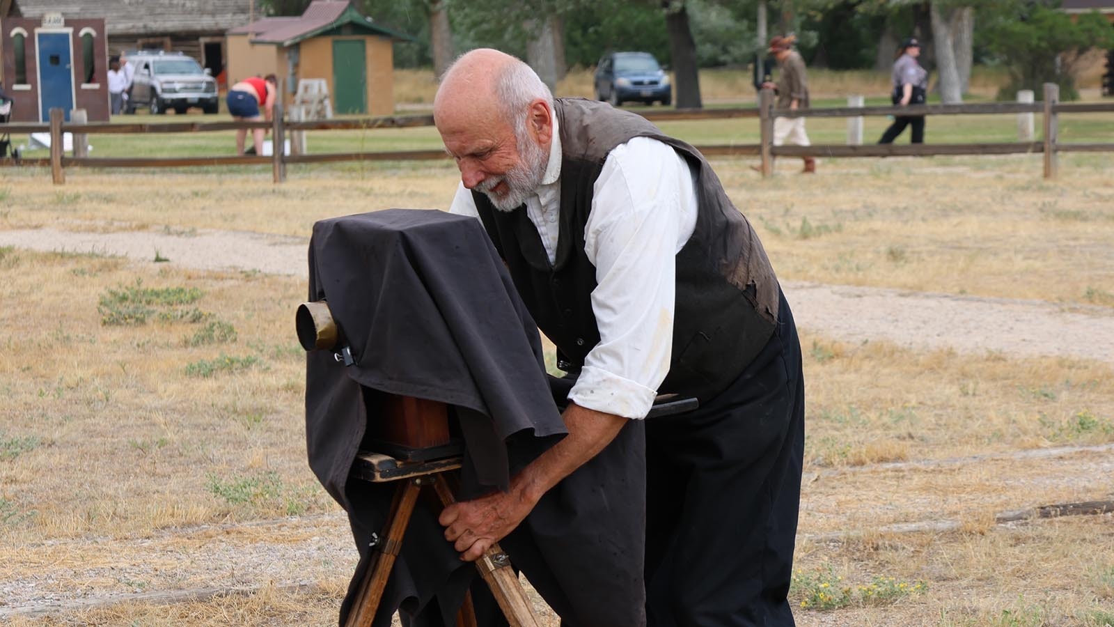 Robert Szabo shows his Fort Caspar audience how a photographer in the Civil War would zoom in – he has to pick up the camera and move it closer.