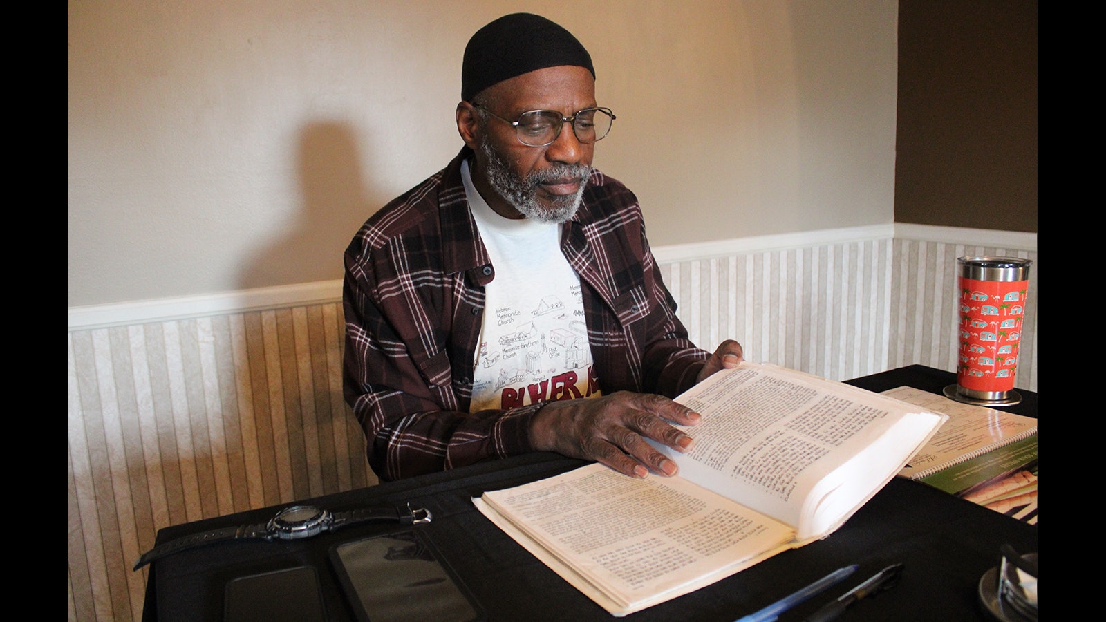 Clarence Fisher reads the Torah at a local Cheyenne coffee shop. He said finding God saved his soul and changed his perspective on life.