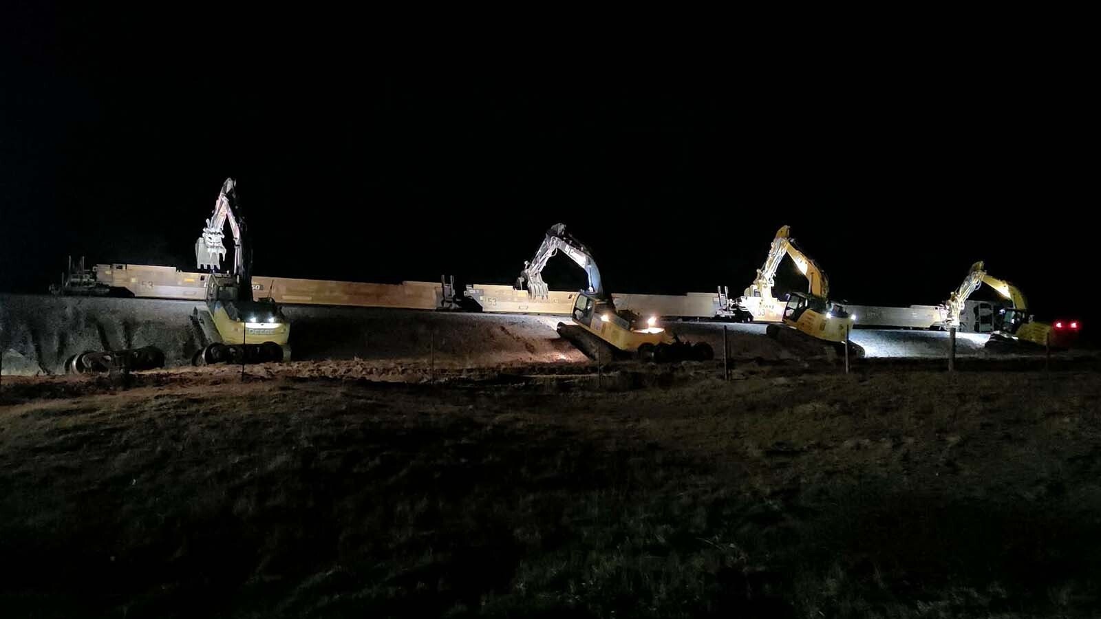 After strong winds blew more than 100 stacked freight cars off BNSF Railway tracks near Cheyenne on Friday, crews mobilized to clean it up. Within 18 hours, the tracks were clear again.
