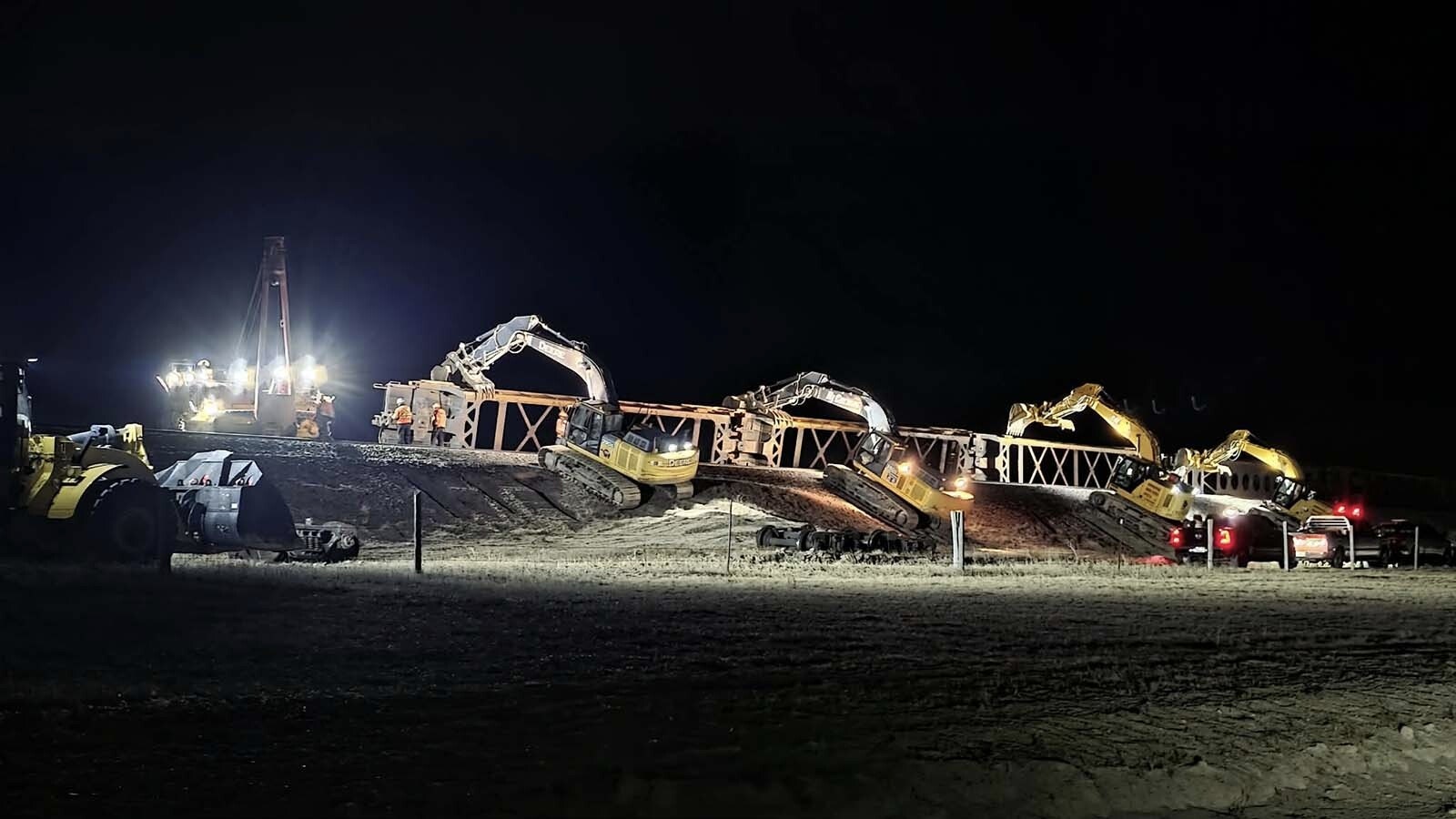 After strong winds blew more than 100 stacked freight cars off BNSF Railway tracks near Cheyenne on Friday, crews mobilized to clean it up. Within 18 hours, the tracks were clear again.