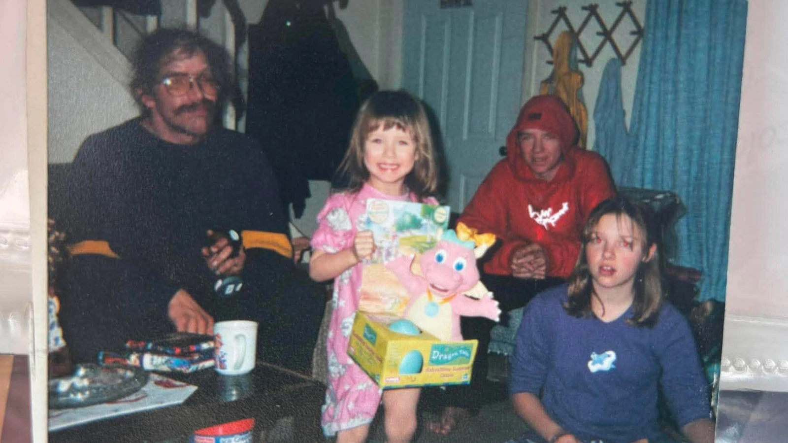 The Haux siblings, Lois, Justy and Chancy, enjoy a Christmas celebration before their father, Clifford "Russ" Haux vanished in November 2003. 