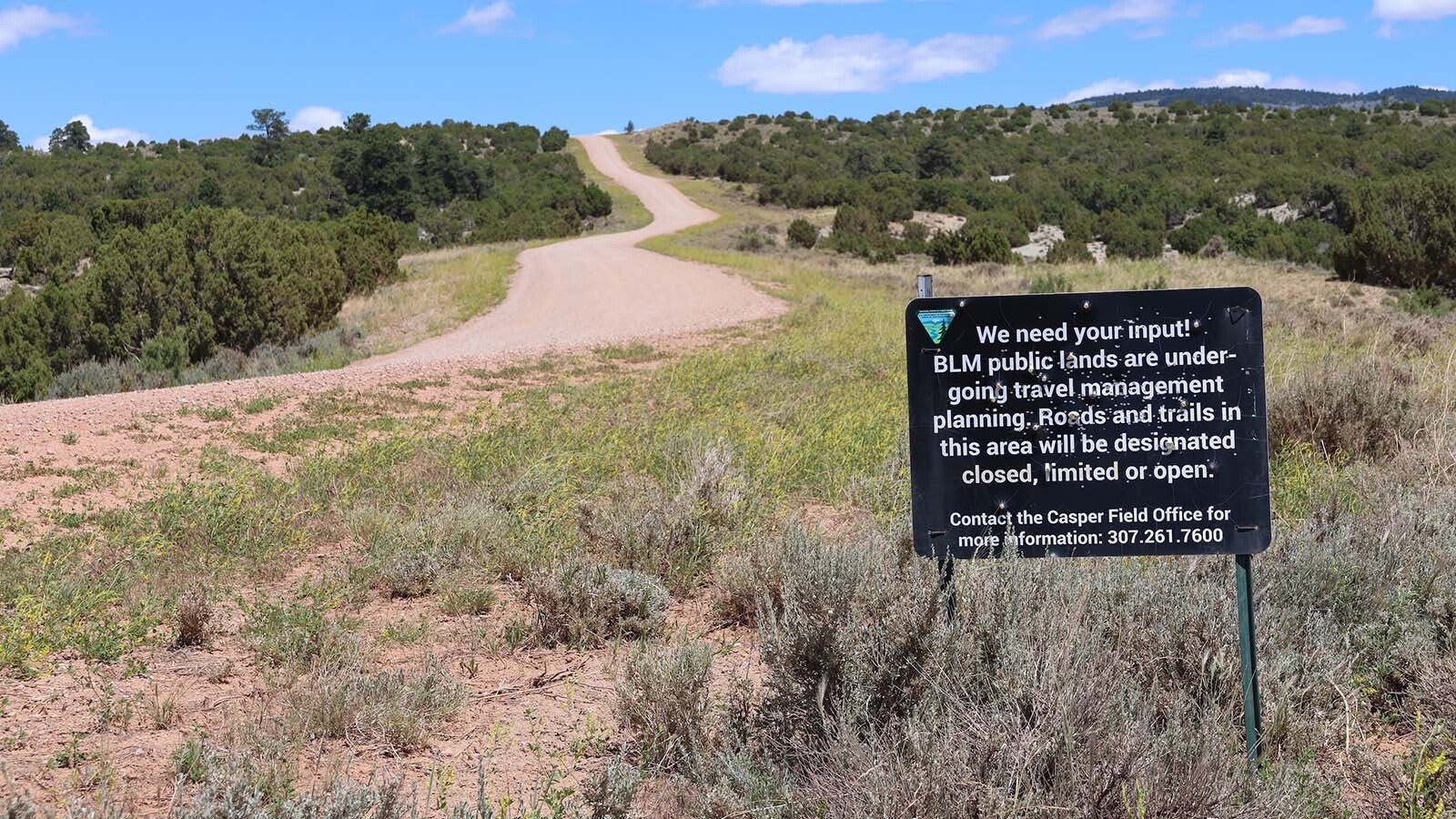 A BLM sign sits beside Circle Drive or County Road 505 south of Casper Mountain asking for input about BLM trails on its lands.