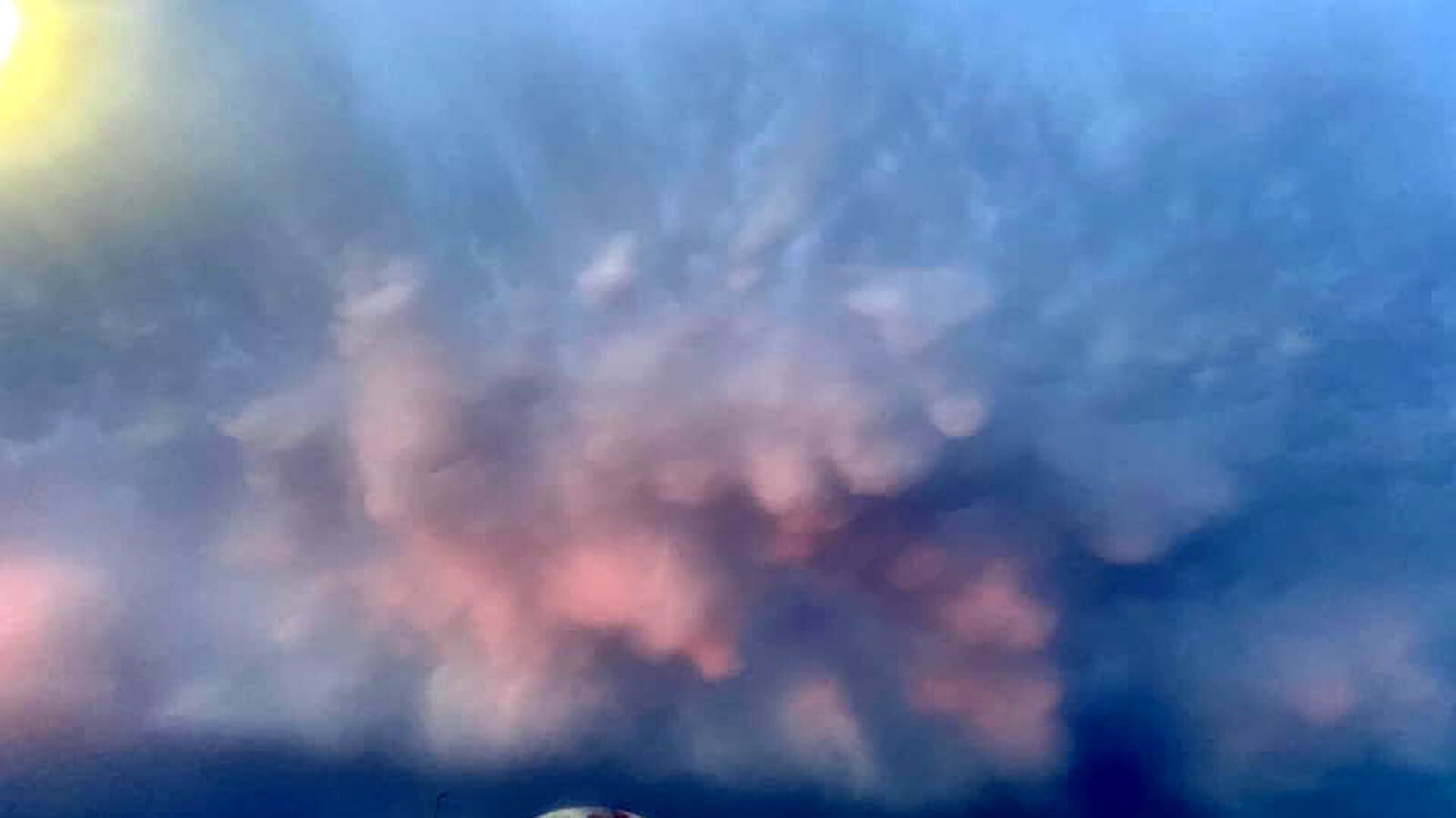 When Maggie Harrop stepped outside after a summer thunderstorm Saturday evening, she saw something spectacular over Laramie, Wyoming. An incredible burst of color seemed to be exploding from the cloud-filled sky.