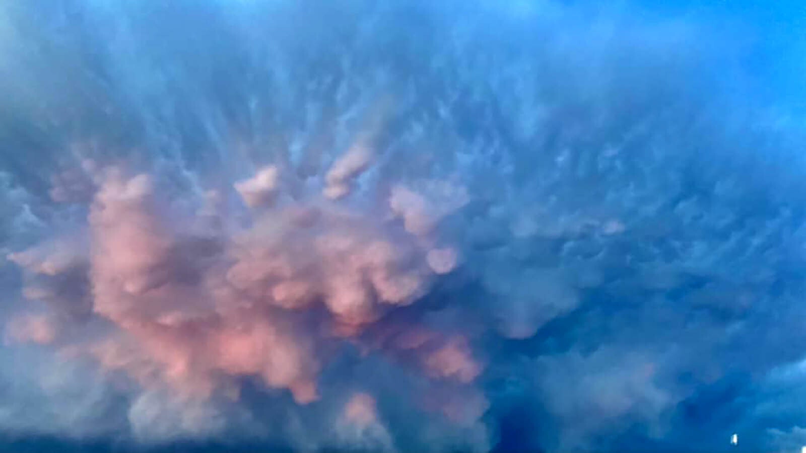 When Maggie Harrop stepped outside after a summer thunderstorm Saturday evening, she saw something spectacular over Laramie, Wyoming. An incredible burst of color seemed to be exploding from the cloud-filled sky.