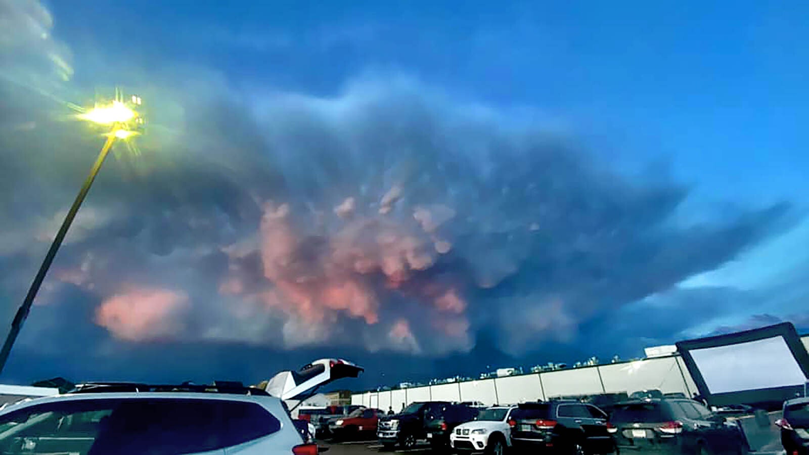 When Maggie Harrop stepped outside after a summer thunderstorm Saturday evening, she saw something spectacular over Laramie, Wyoming. An incredible burst of color seemed to be exploding from the cloud-filled sky.