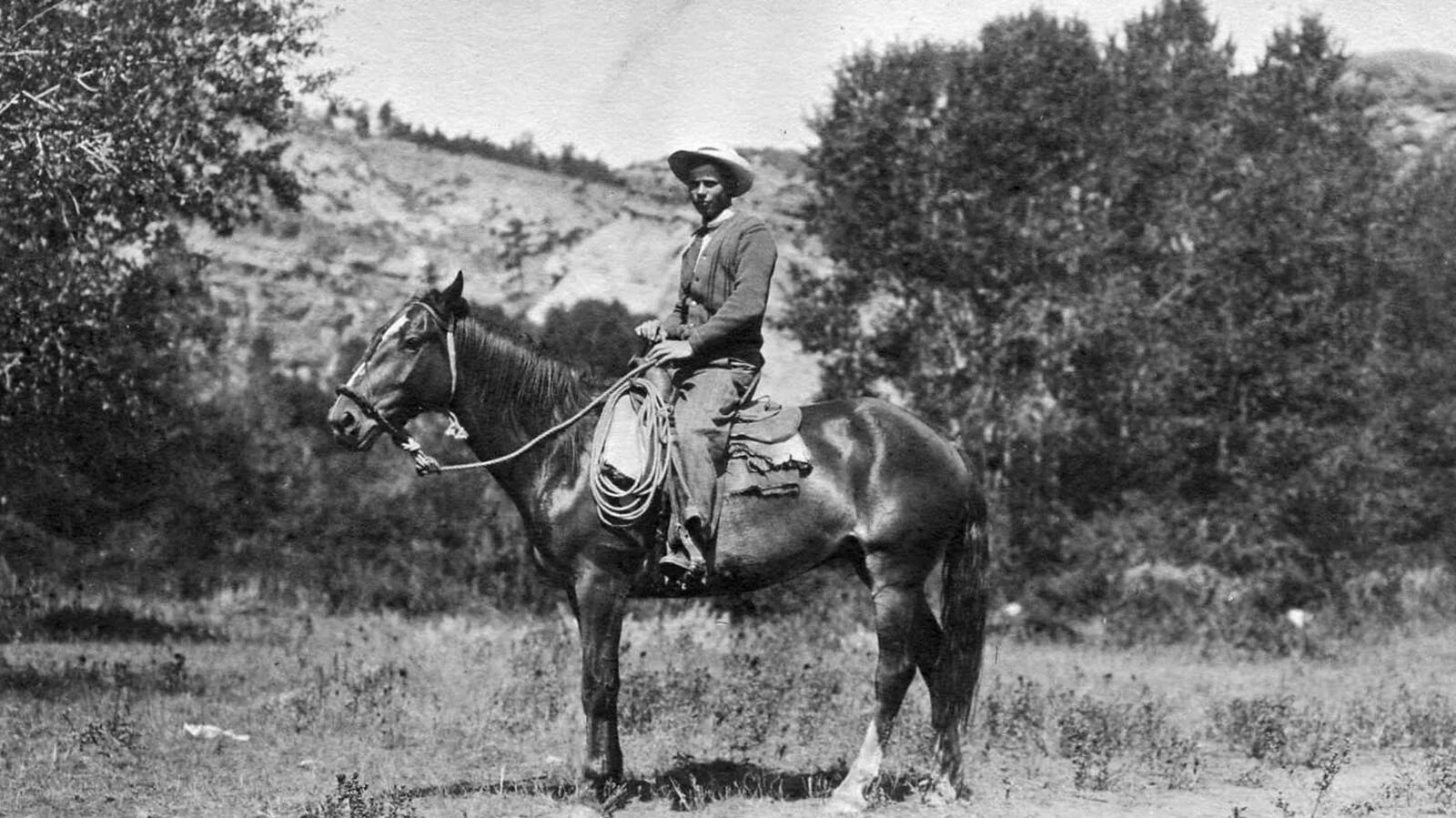 One of Campbell County’s oldest homesteading families is proposing a land swap and sale that could unlock 250 million tons of coal on Wyoming state land. Supporters pitch it as a win-win for the ranch and the state — but how much is the coal worth? Here Earnest Hall is on horseback in the early 1900s on the homestead.