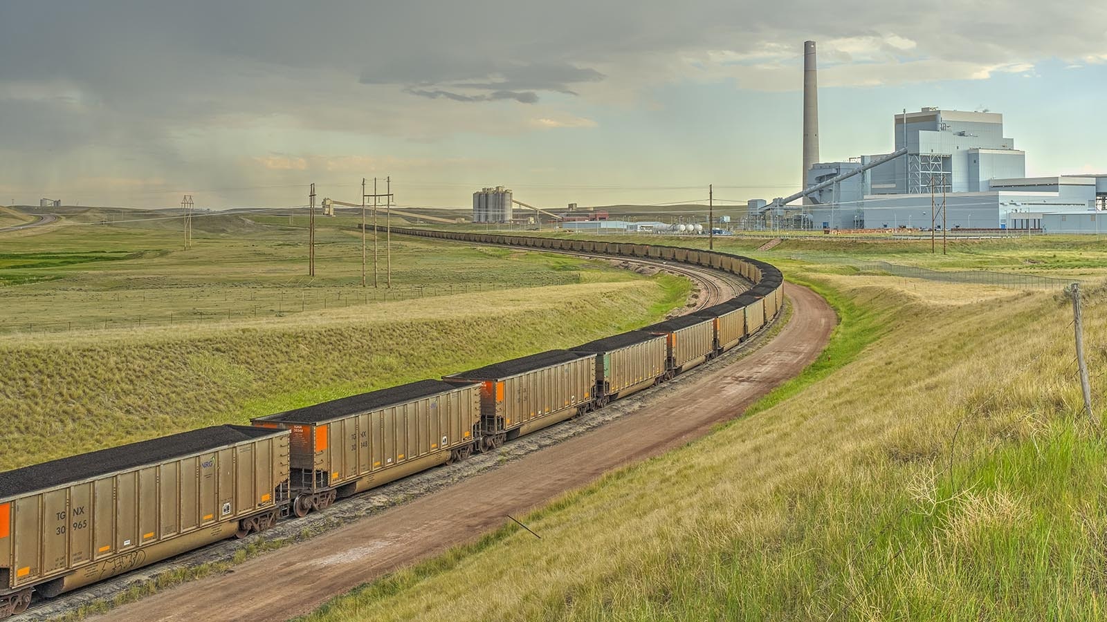 A loaded coal train rolls past the Dry Fork Station power plant about 10 miles north of Gillette, Wyoming.