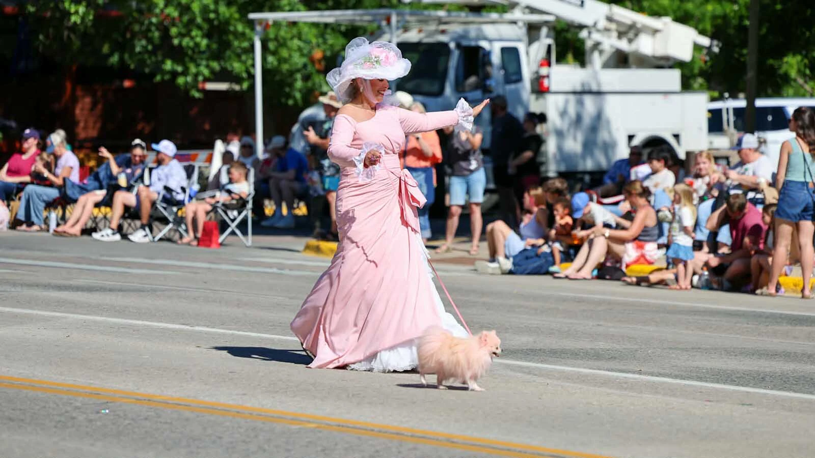 Lisa Sheets Kealey honors the legacy of her mother, Hope Sheets, as "The Pink Lady" in the 2026 Cody Stampede Parade.