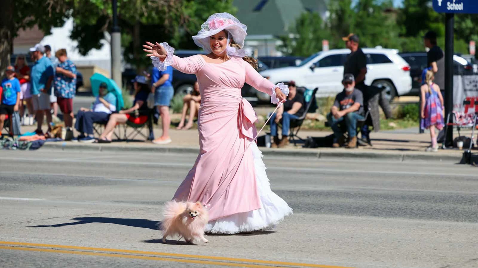 Lisa Sheets Kealey honors the legacy of her mother, Hope Sheets, as "The Pink Lady" in the 2026 Cody Stampede Parade.