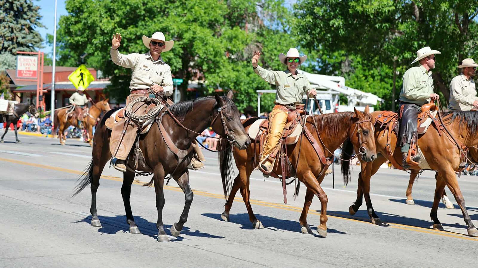 Riders wave to the crowds in Cody during the 2026 Cody Stampede Parade.