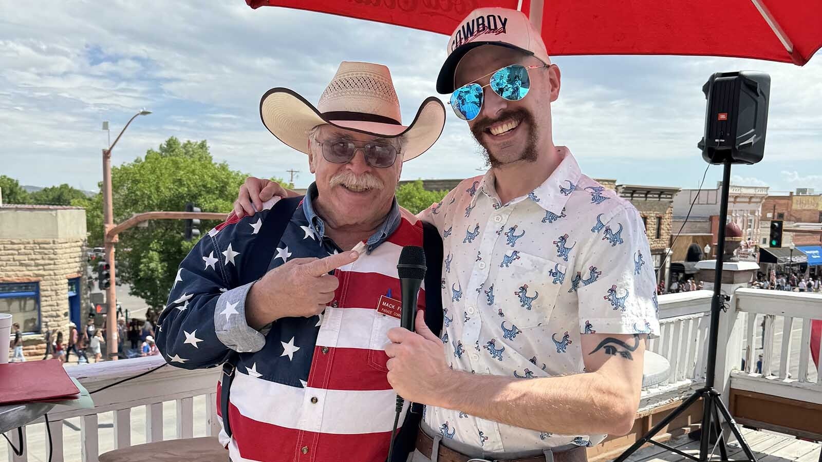 Andrew Rossi, right, giving a thumbs-up with Mack Frost atop the Irma Hotel during the 2025 Cody Stampede Parade.