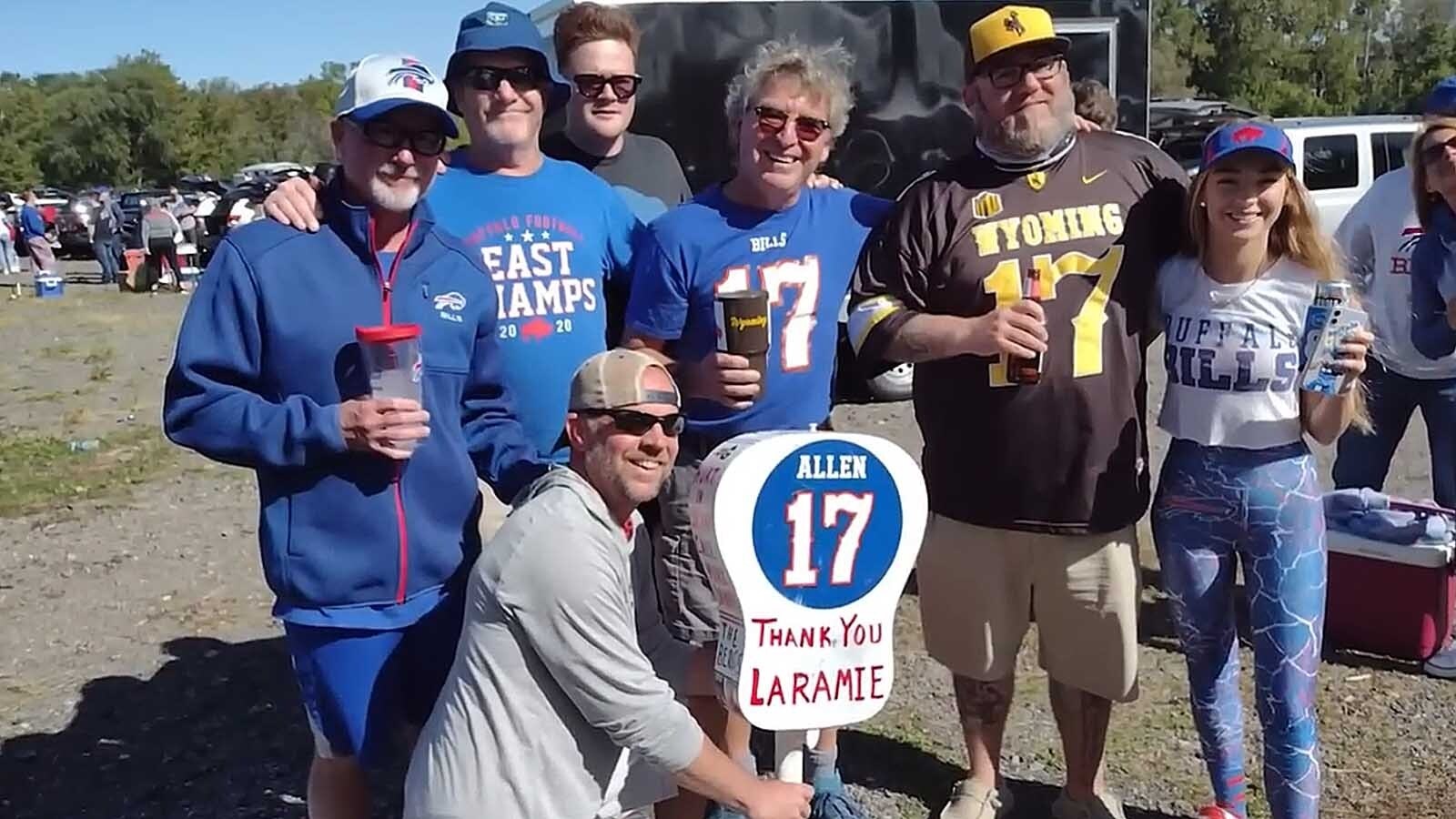 A group of Josh Allen fans in Buffalo for a game, including 7220 Sports founder and Wyomingite Cody Tucker, second from right. The sign shows Buffalo appreciates Wyoming as much as the Cowboy State has embraced the Bills.